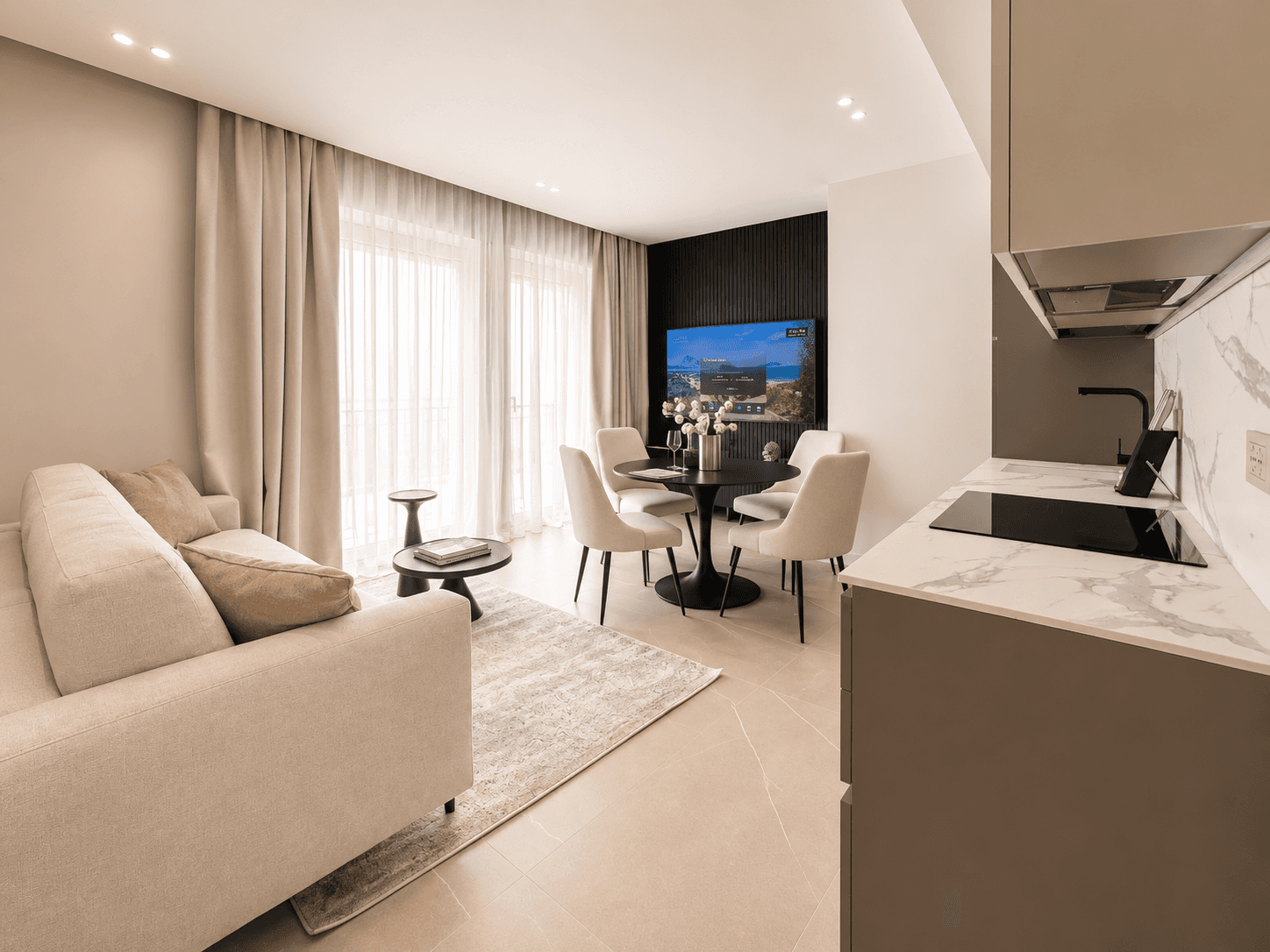 AZULIS DelleTerme Suites Living room with open kitchen and wall mounted smart TV by RENTAL12