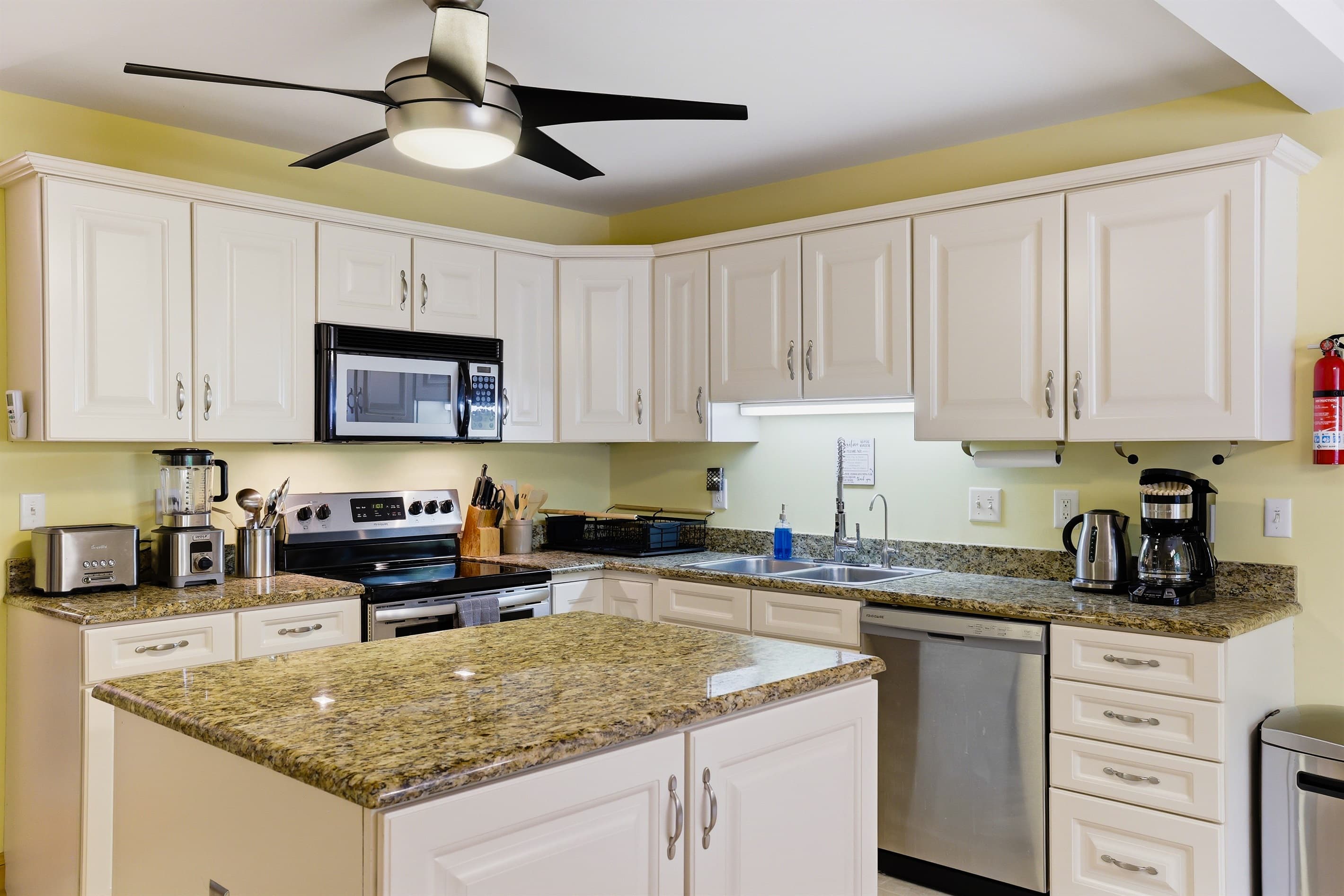 Kitchen with granite countertops and stainless-steel appliances