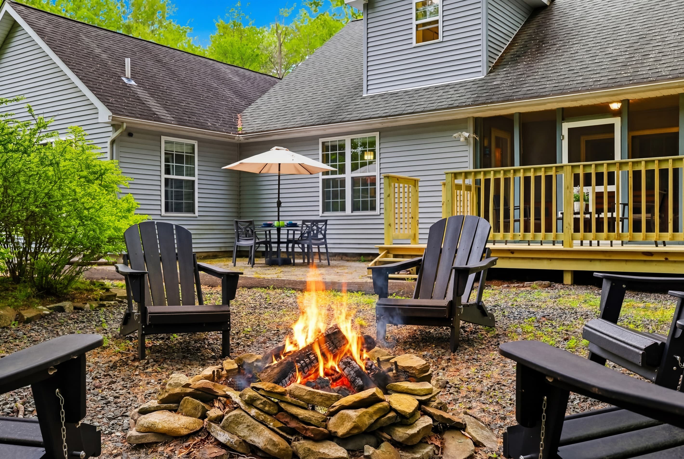 Relax by the firepit in the backyard