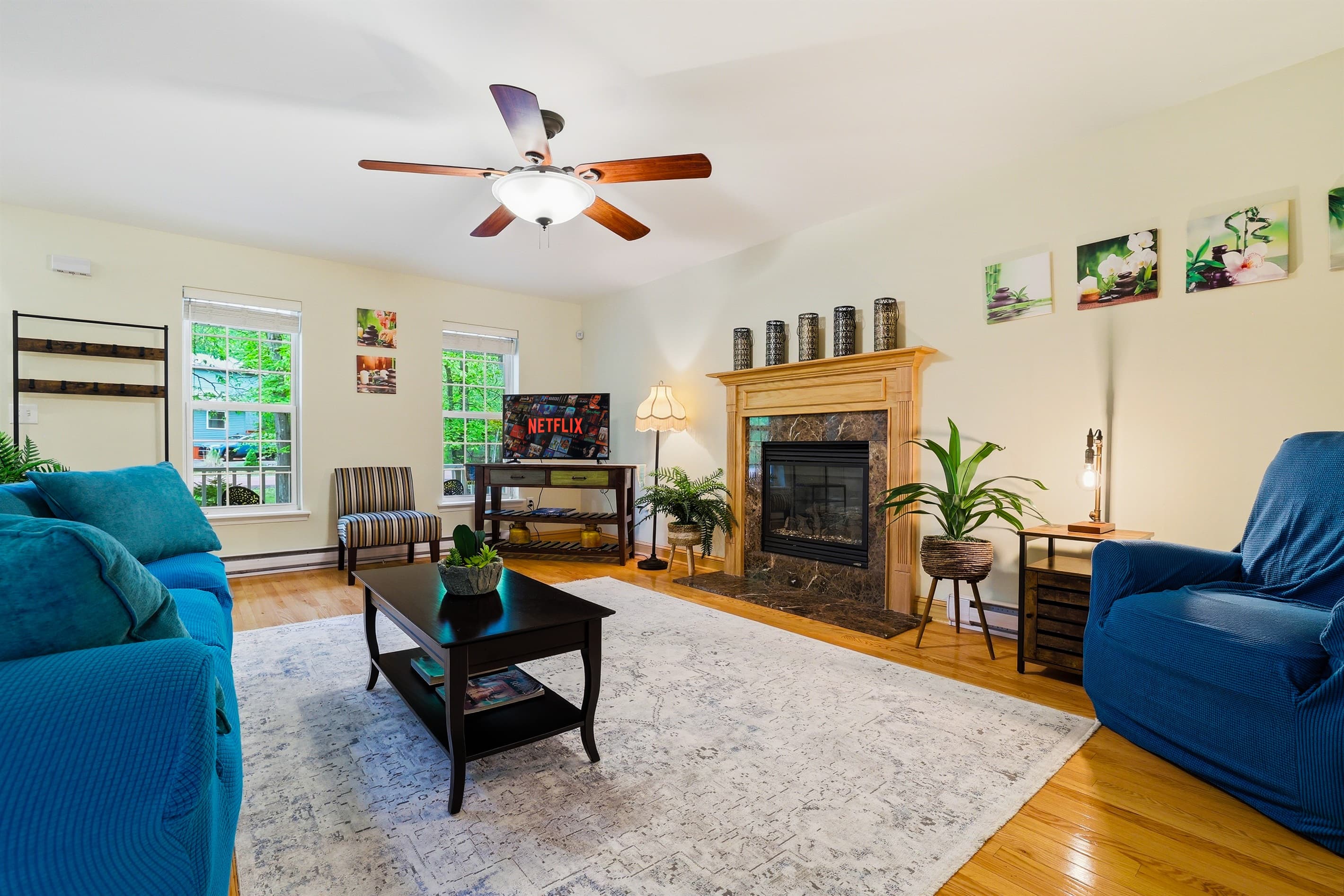 Living room with comfortable seating, propane fireplace and TV