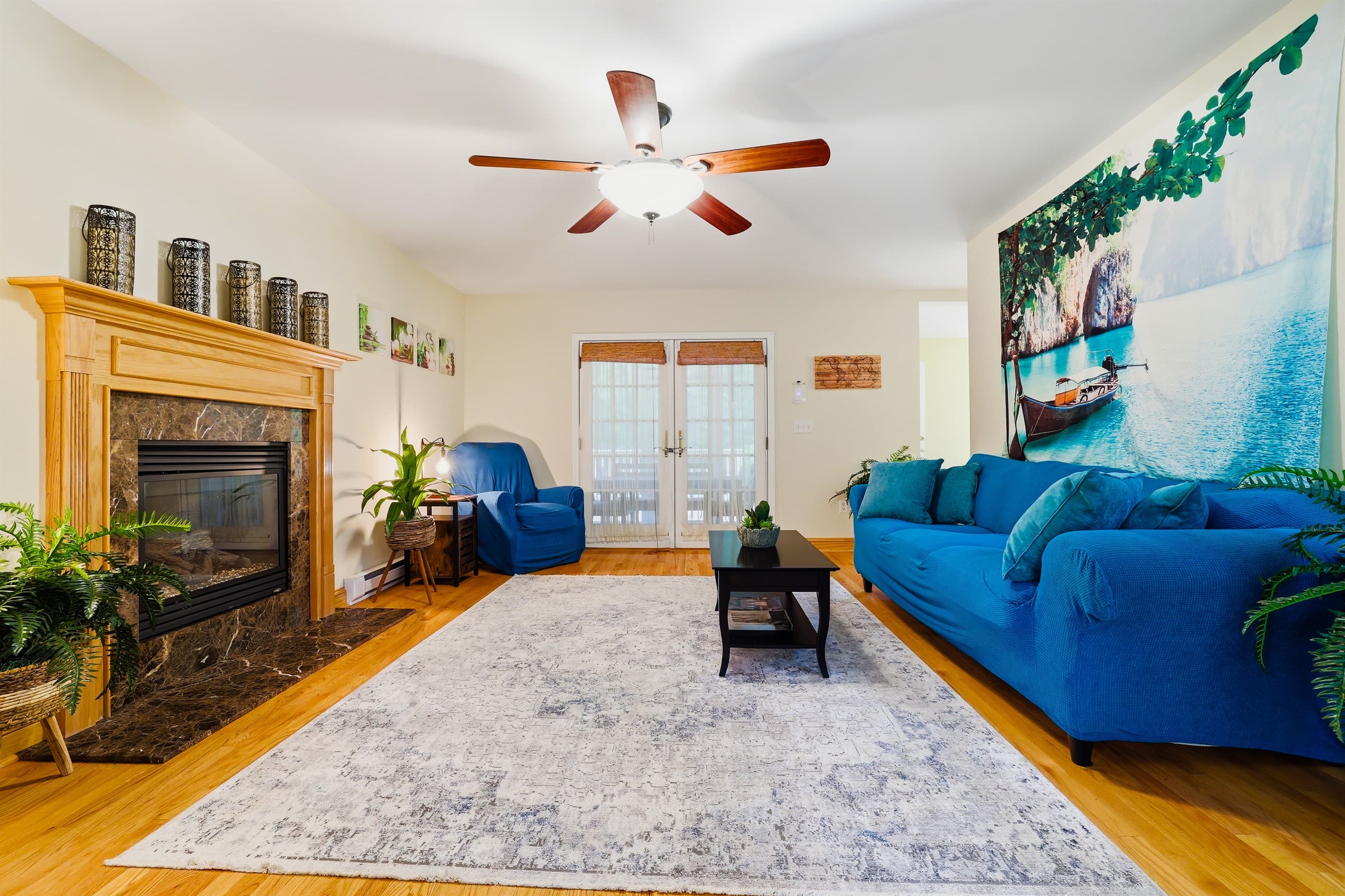 Living room with comfortable seating, propane fireplace and TV