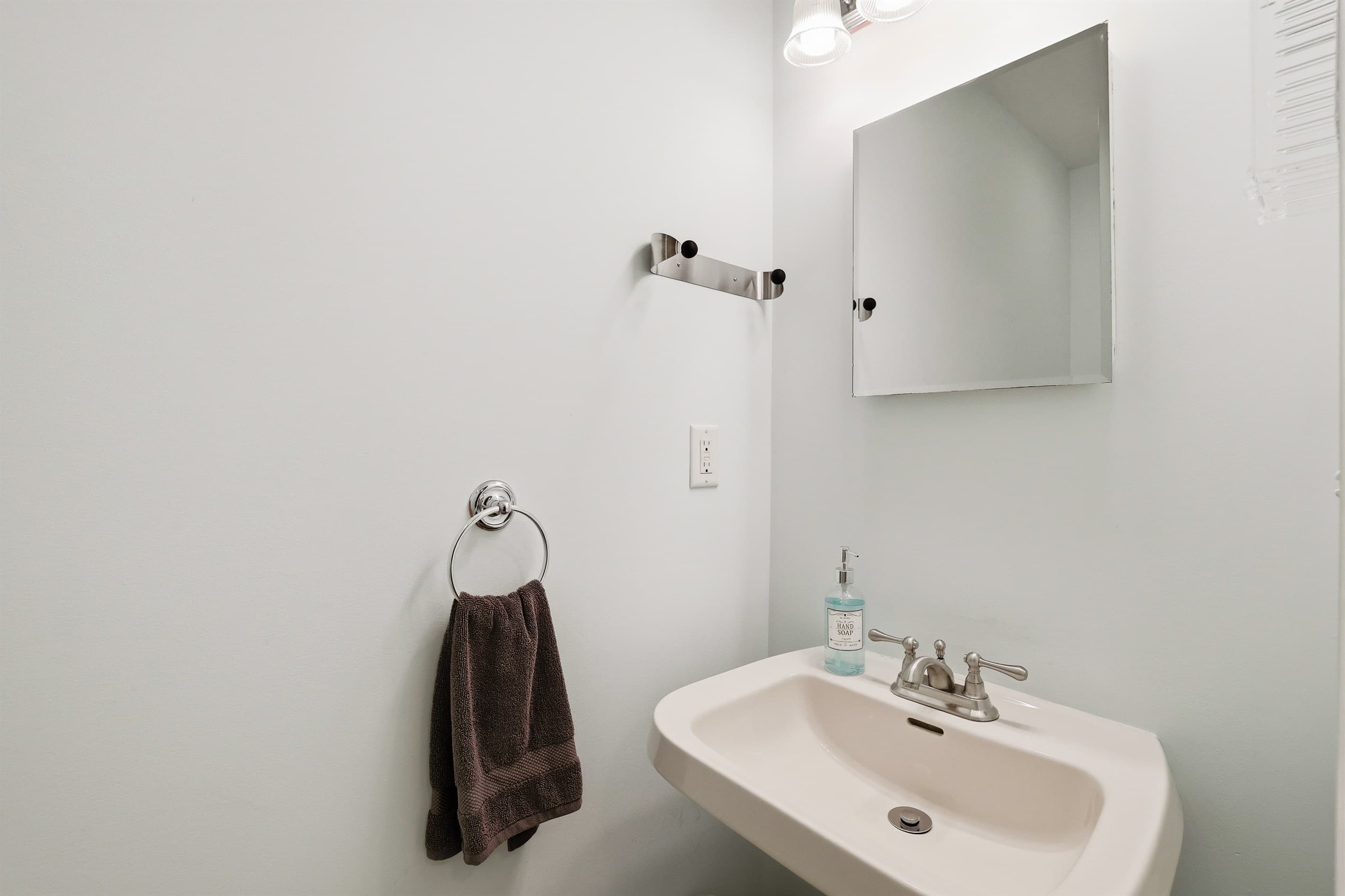 Bathroom 3.  Sink and Toilet. Next to laundry area