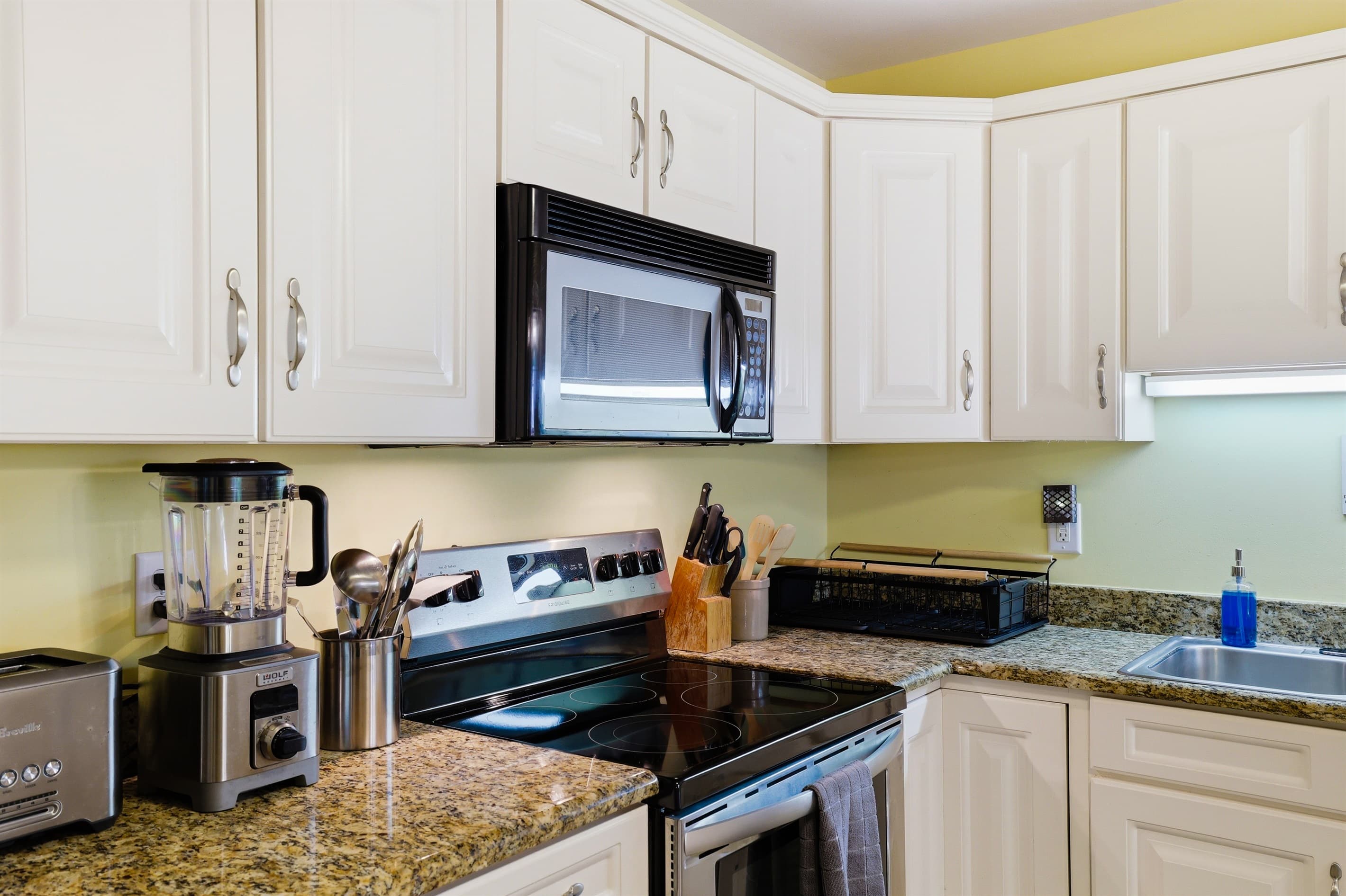 Kitchen with granite countertops and stainless-steel appliances