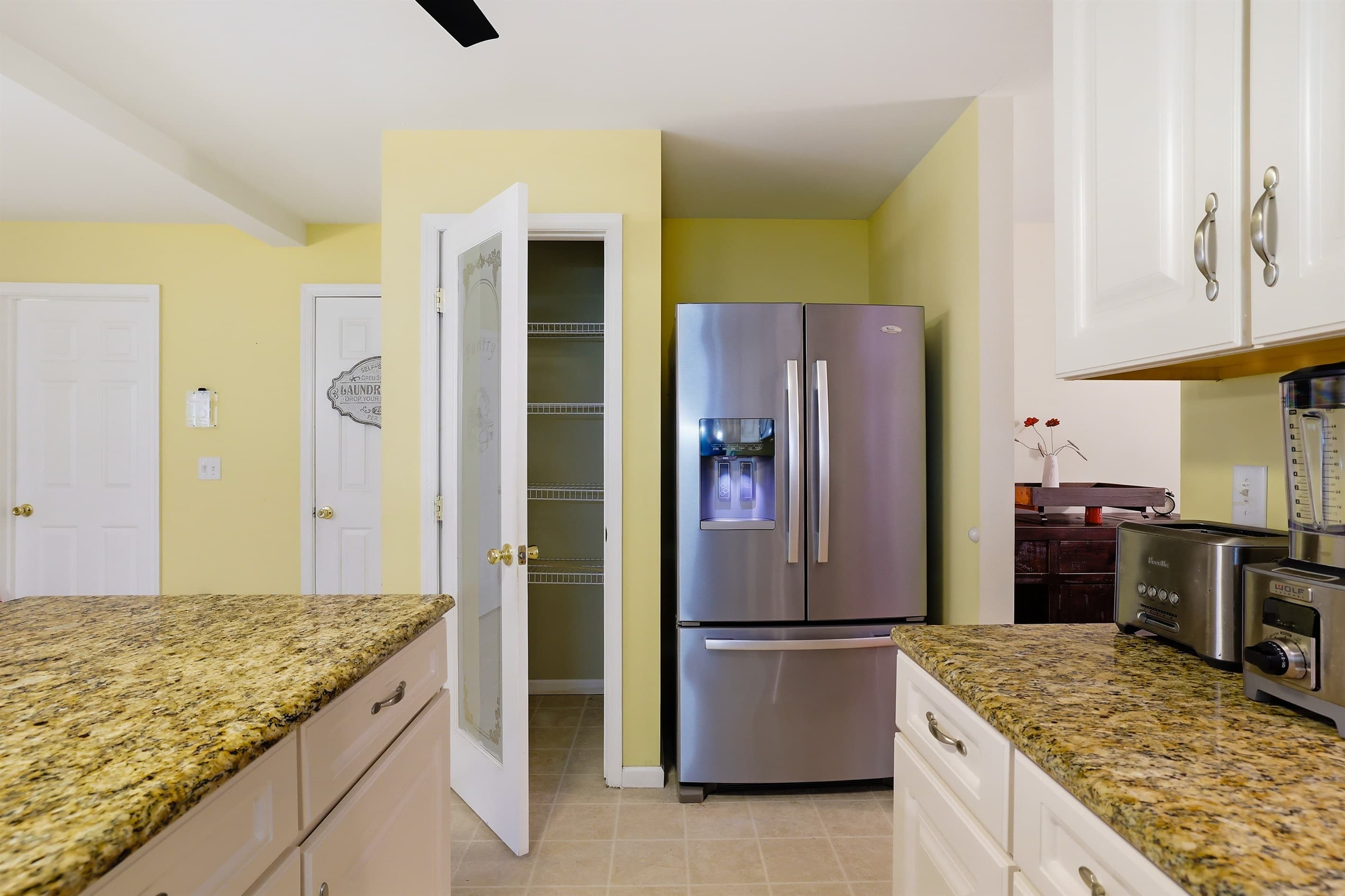Kitchen with granite countertops and stainless-steel appliances