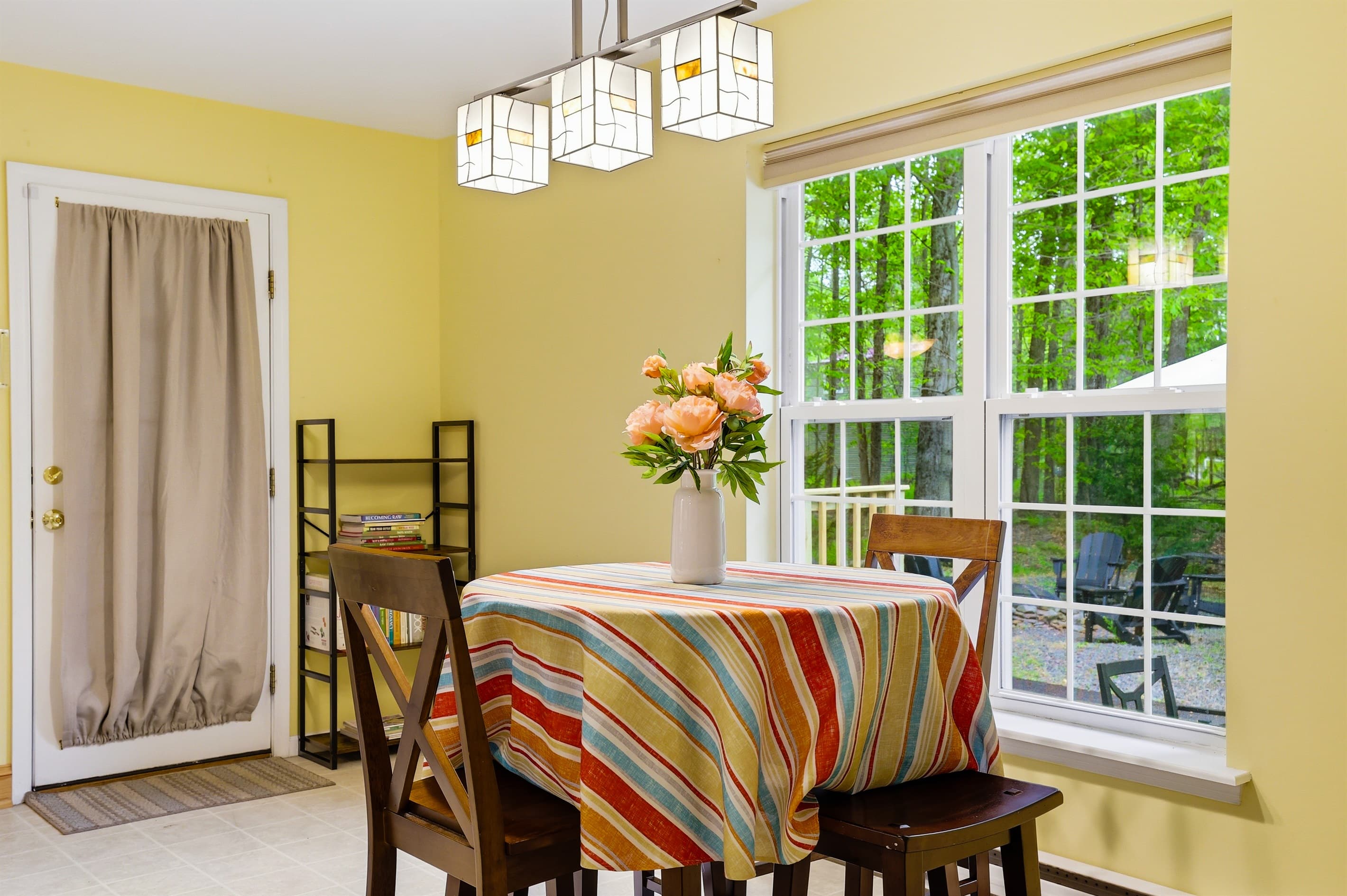 Round table with seating next to kitchen