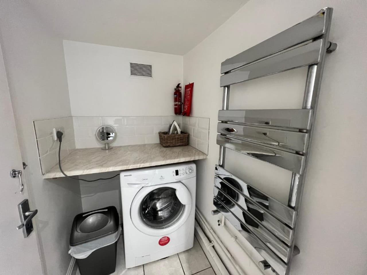 Utility room - washer, dryer, stainless cabinets, fire extinguisher (angle 2)