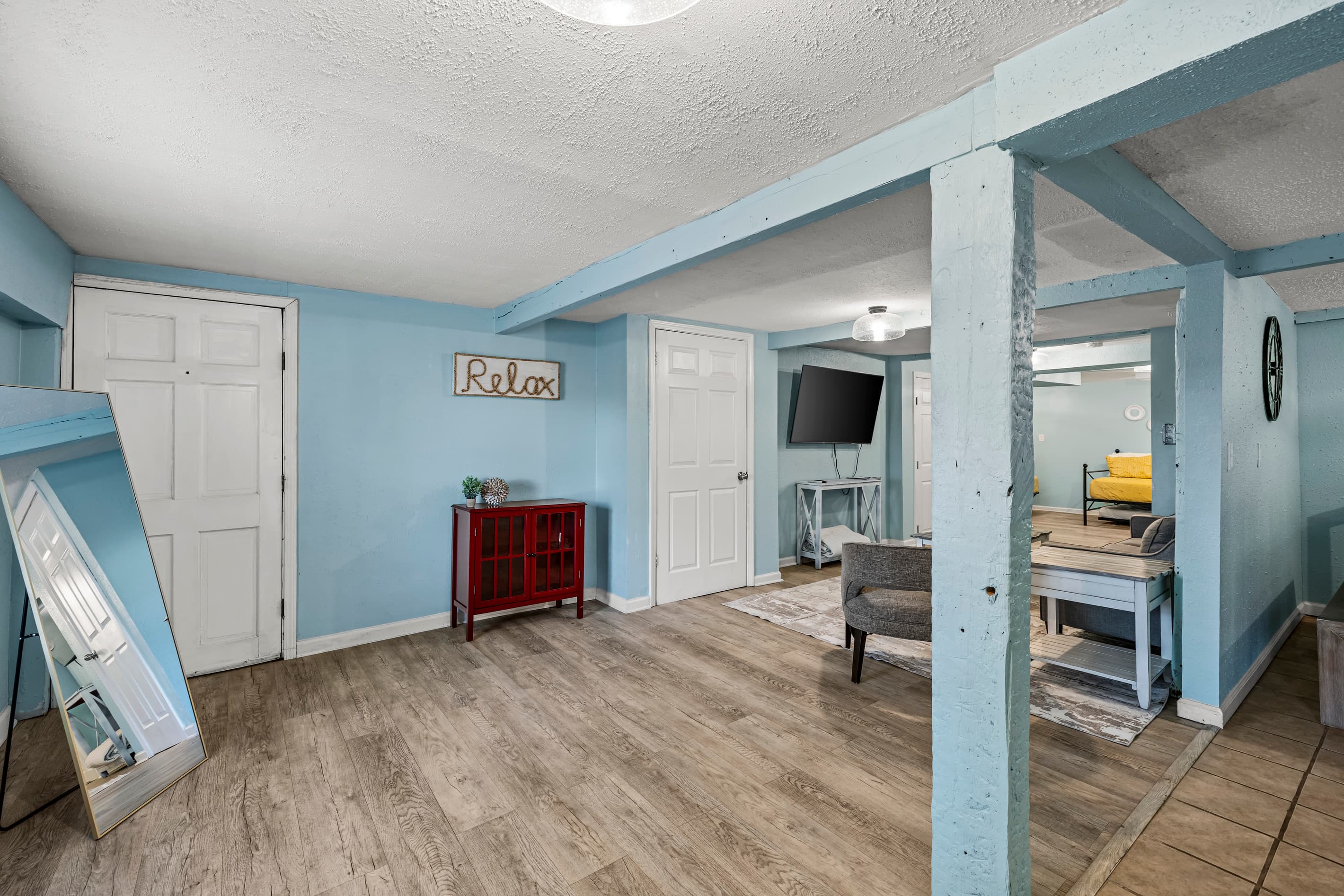 The original brick fireplace is the heart of the studio — a rare and charming feature that adds warmth and character to this historic Galveston retreat.