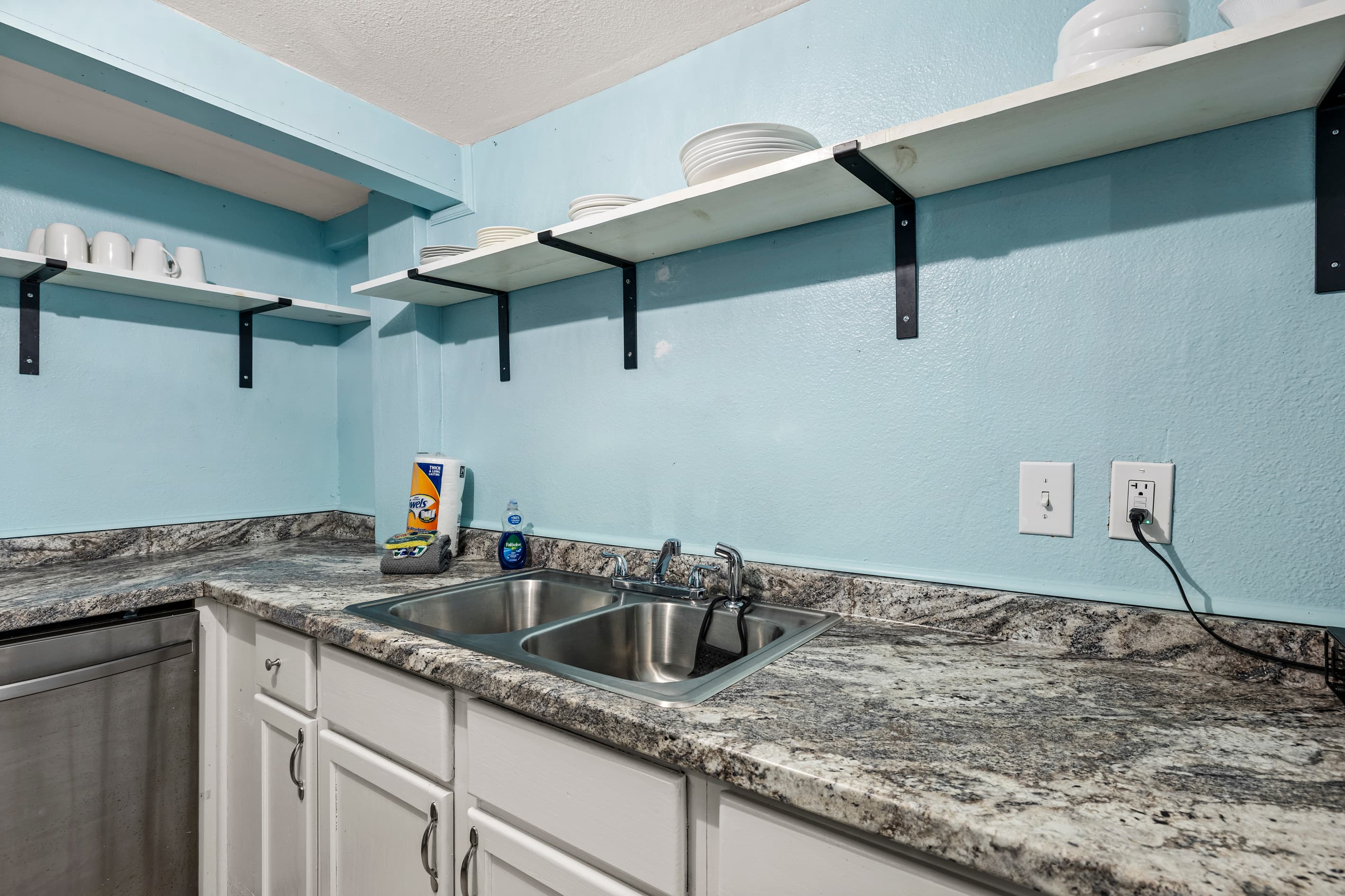 The open-plan studio keeps things connected — living area, dining table, and kitchen all within easy reach for a seamless, comfortable stay.