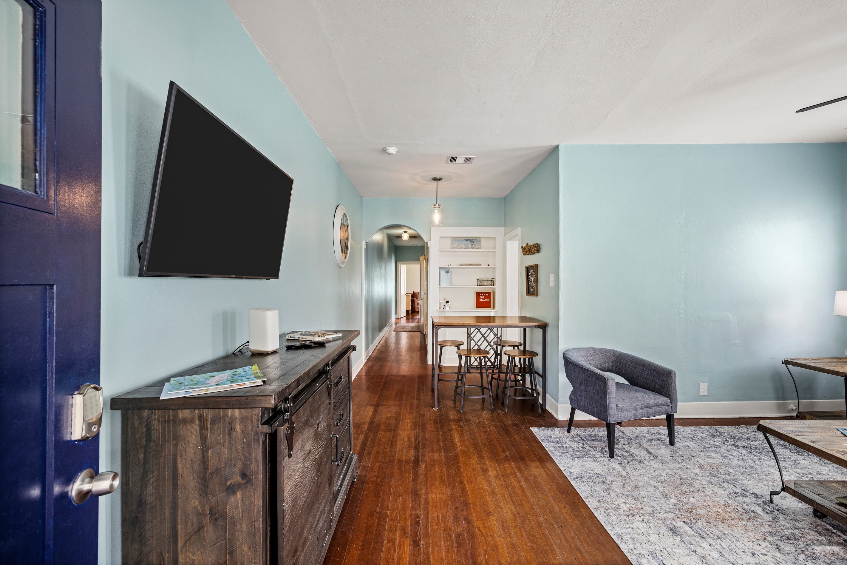 Step inside Starboard at M and the character hits immediately — original hardwood floors, teal accent walls, and the easy warmth of a Galveston classic.