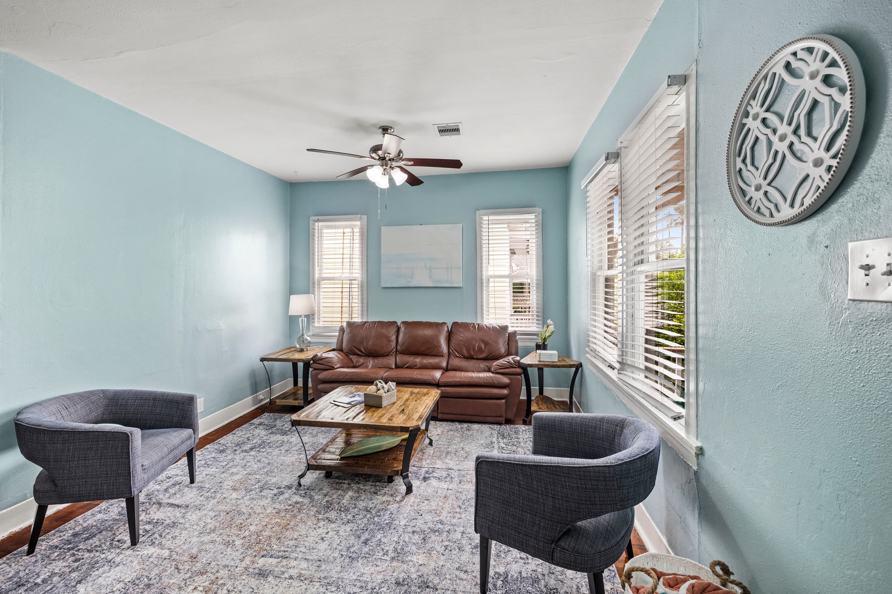 The open living room is comfortable and spacious — a great place to gather after a day on the water, on the beach, or exploring the historic East End.