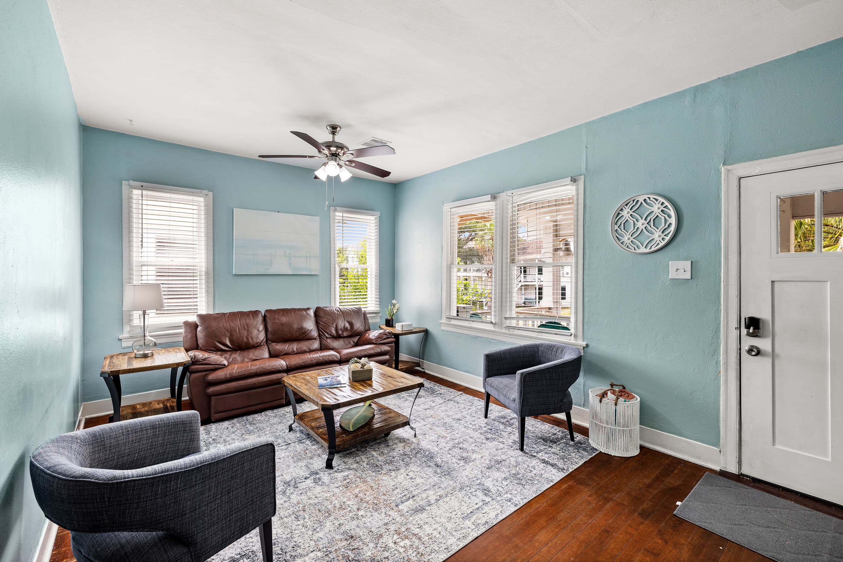 The living room flows naturally toward the dining area and kitchen — an open, connected layout that makes the whole group feel at home.