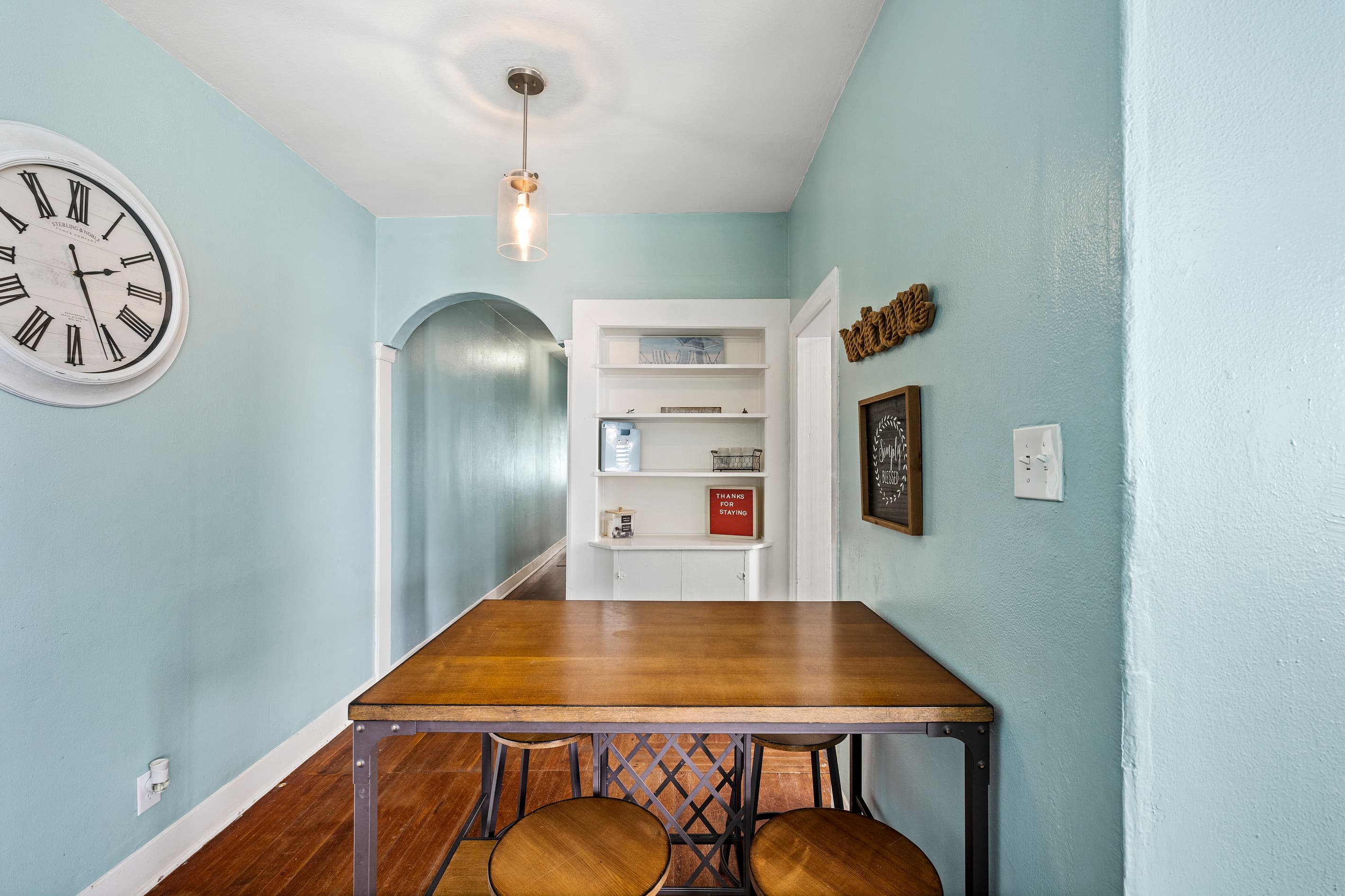 Dark cabinetry and quality appliances give the kitchen a polished, well-designed feel — cook in or order out, either way you are set.