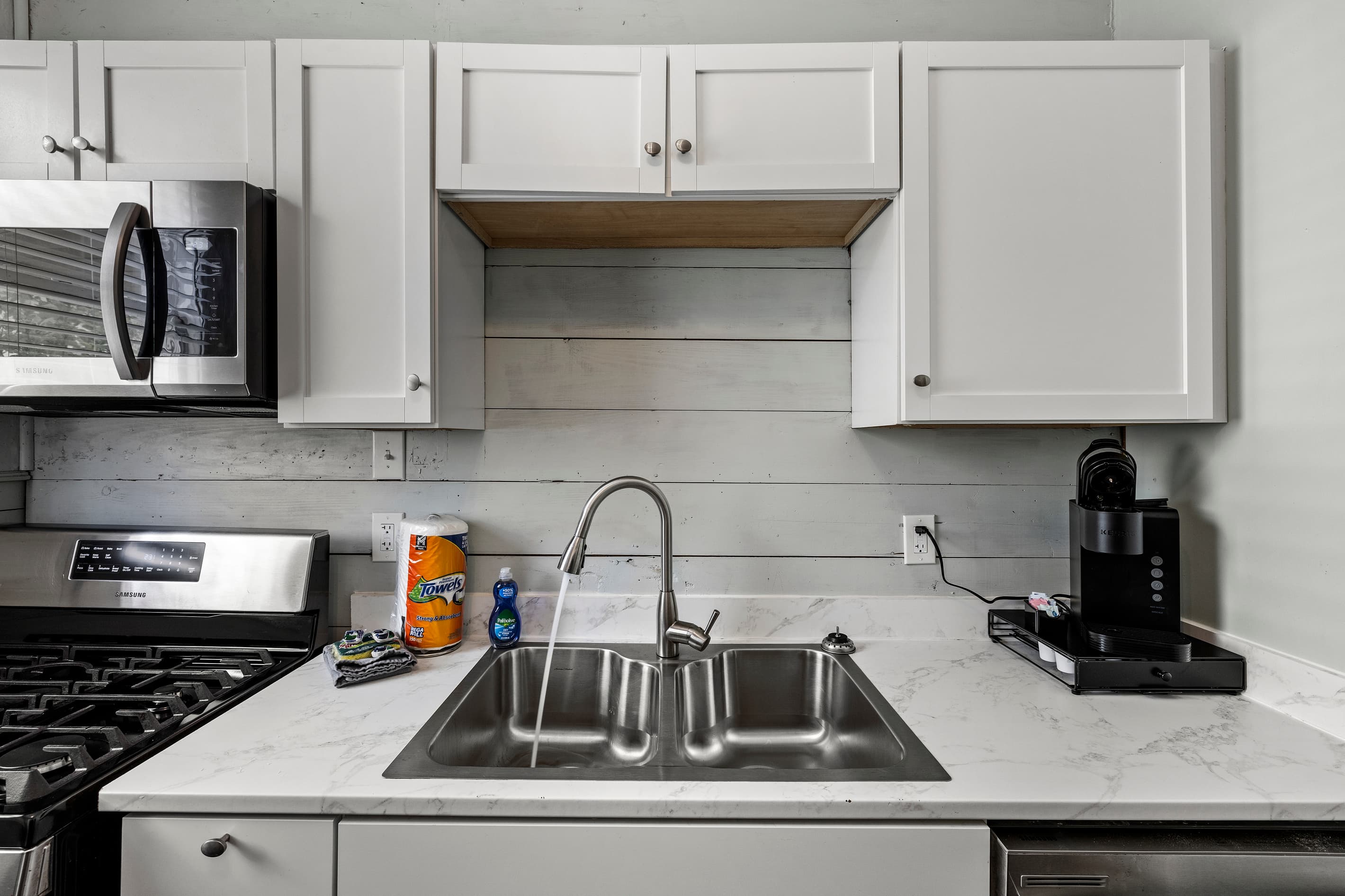 Every detail in the kitchen is thoughtfully outfitted — the Keurig is stocked with K-cups, cookware is ready, and the dishwasher keeps cleanup fast.