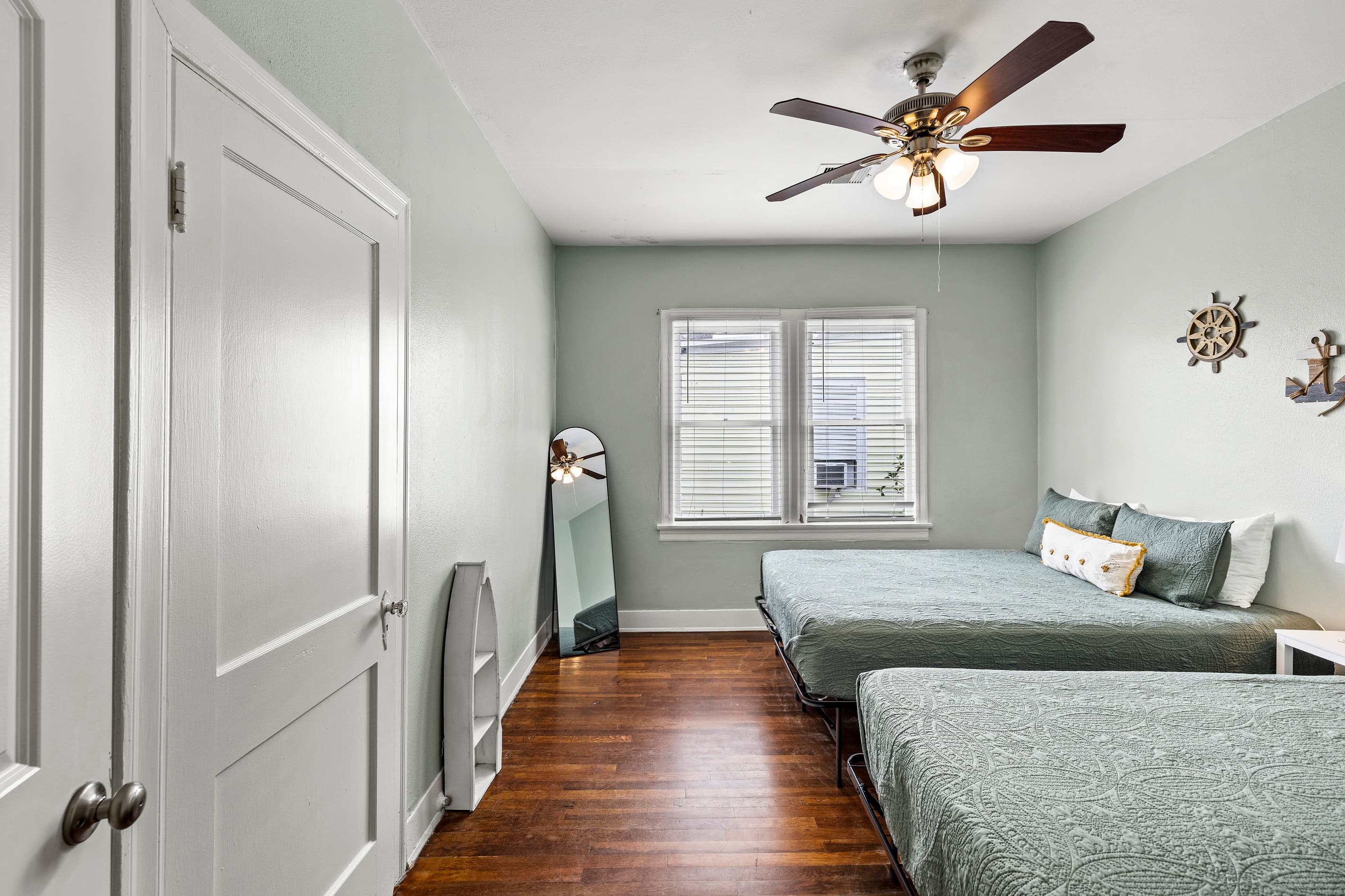 Original hardwood floors and warm natural light give the bedrooms at Starboard at M a timeless, comfortable feel — restful nights guaranteed.