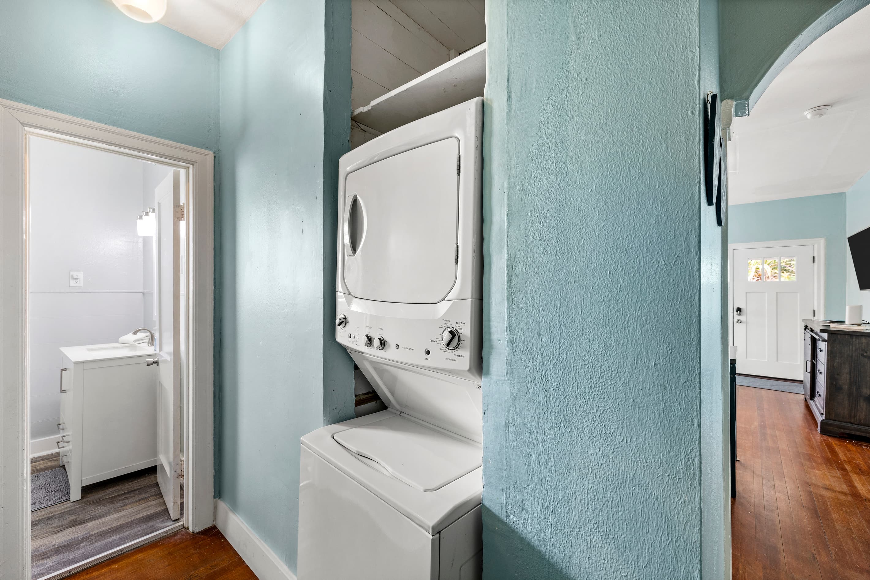 The full bathroom at Starboard at M features beautifully tiled walls and a clean, bright design — a refreshing space after a day in the Galveston sun.