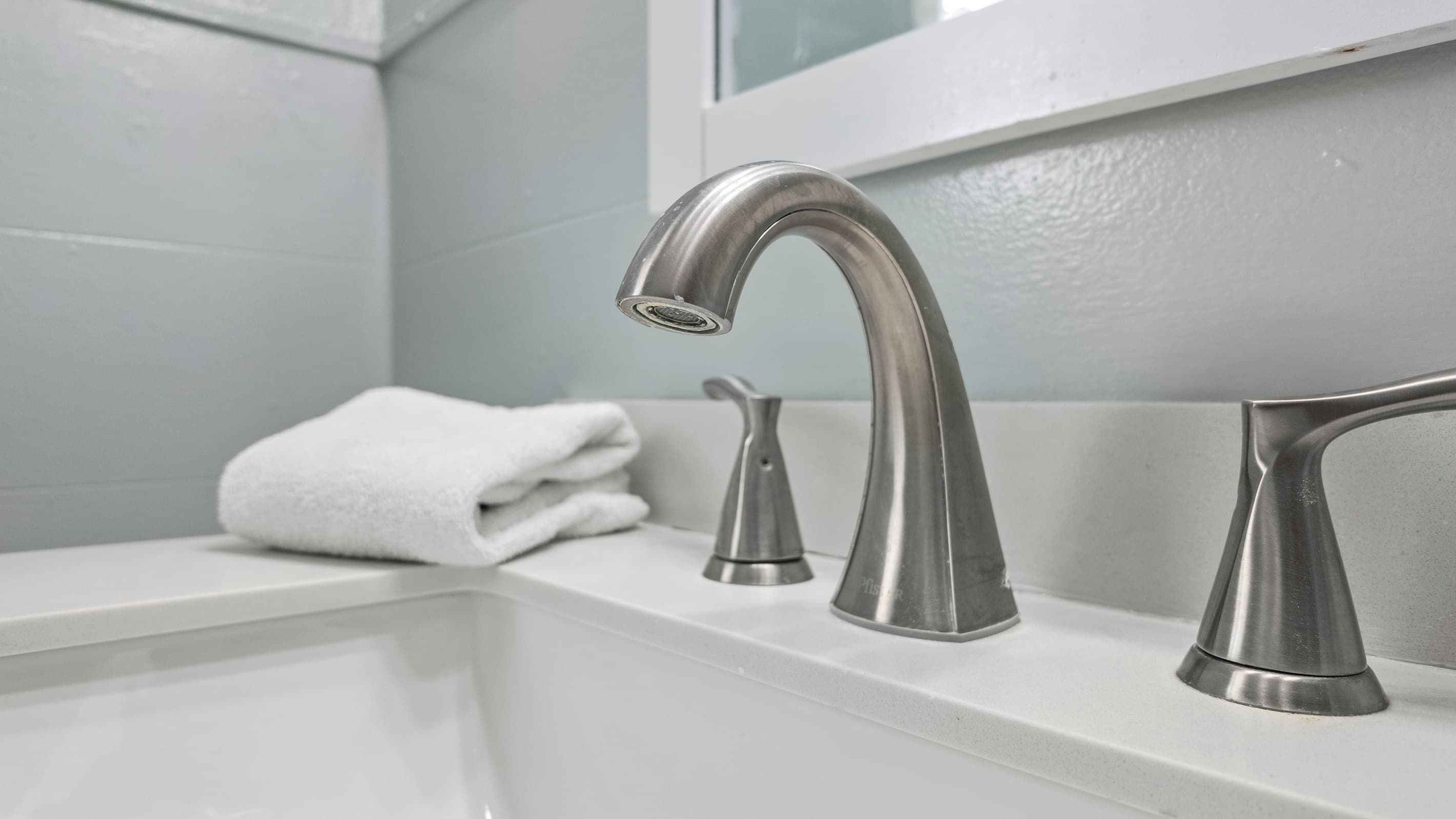 The half bath keeps the morning routine moving for multiple guests — clean, functional, and conveniently located throughout the unit.