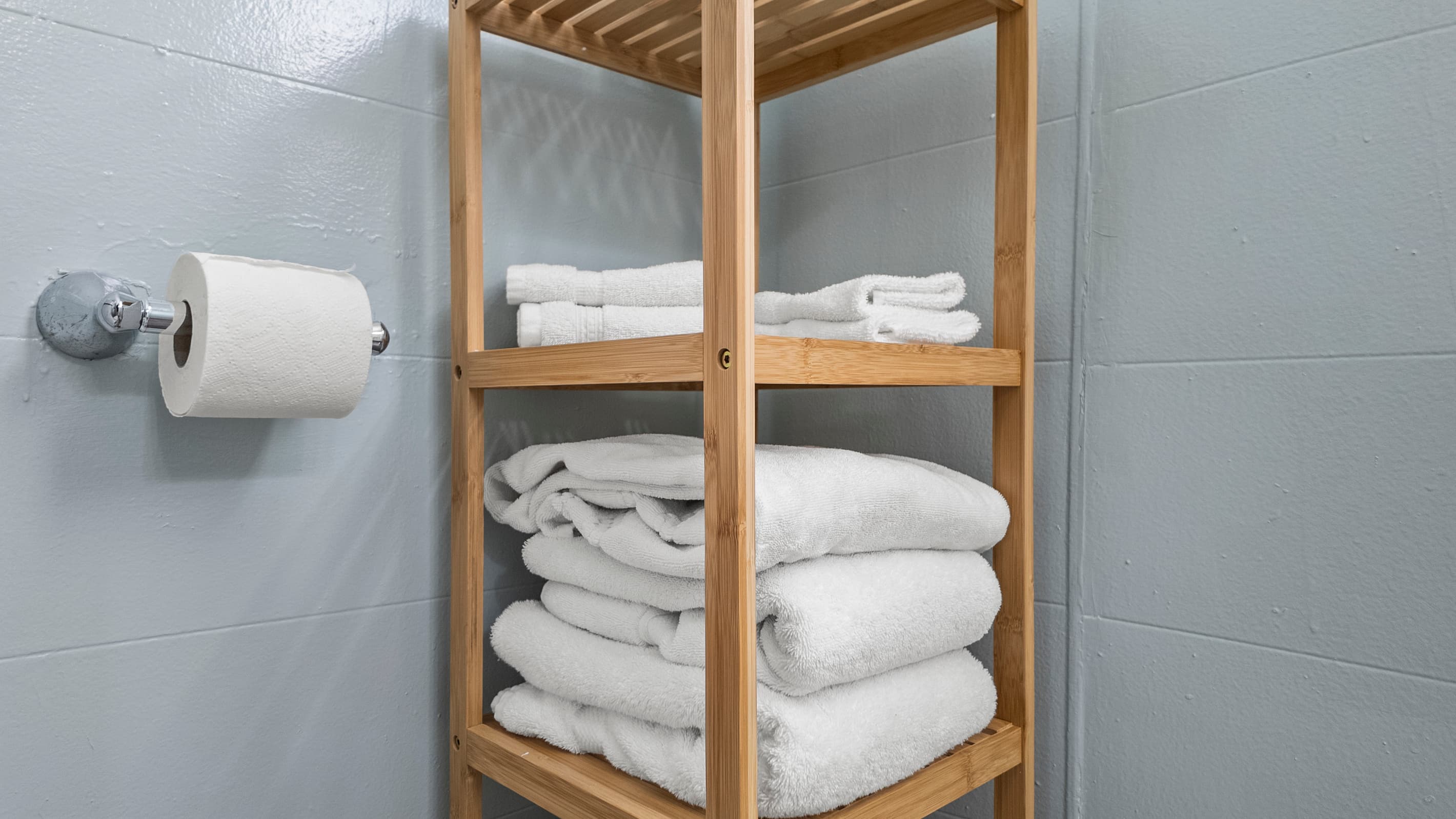 Fresh towels are stacked and ready — no need to pack linens, everything is provided so you can focus on enjoying your Galveston stay.