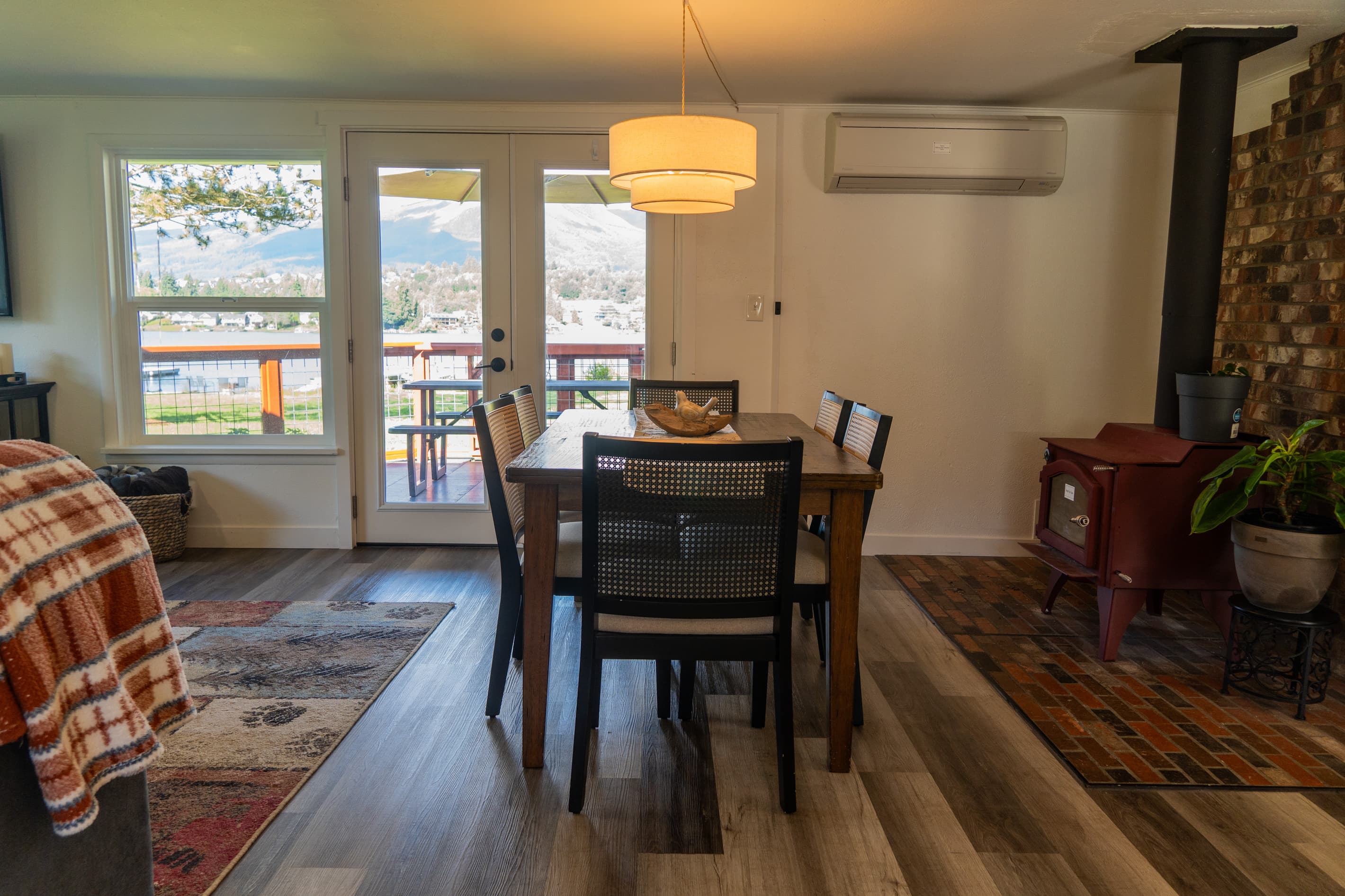 A warm dining space where light and form come together, inviting shared meals and quiet moments around the table.
