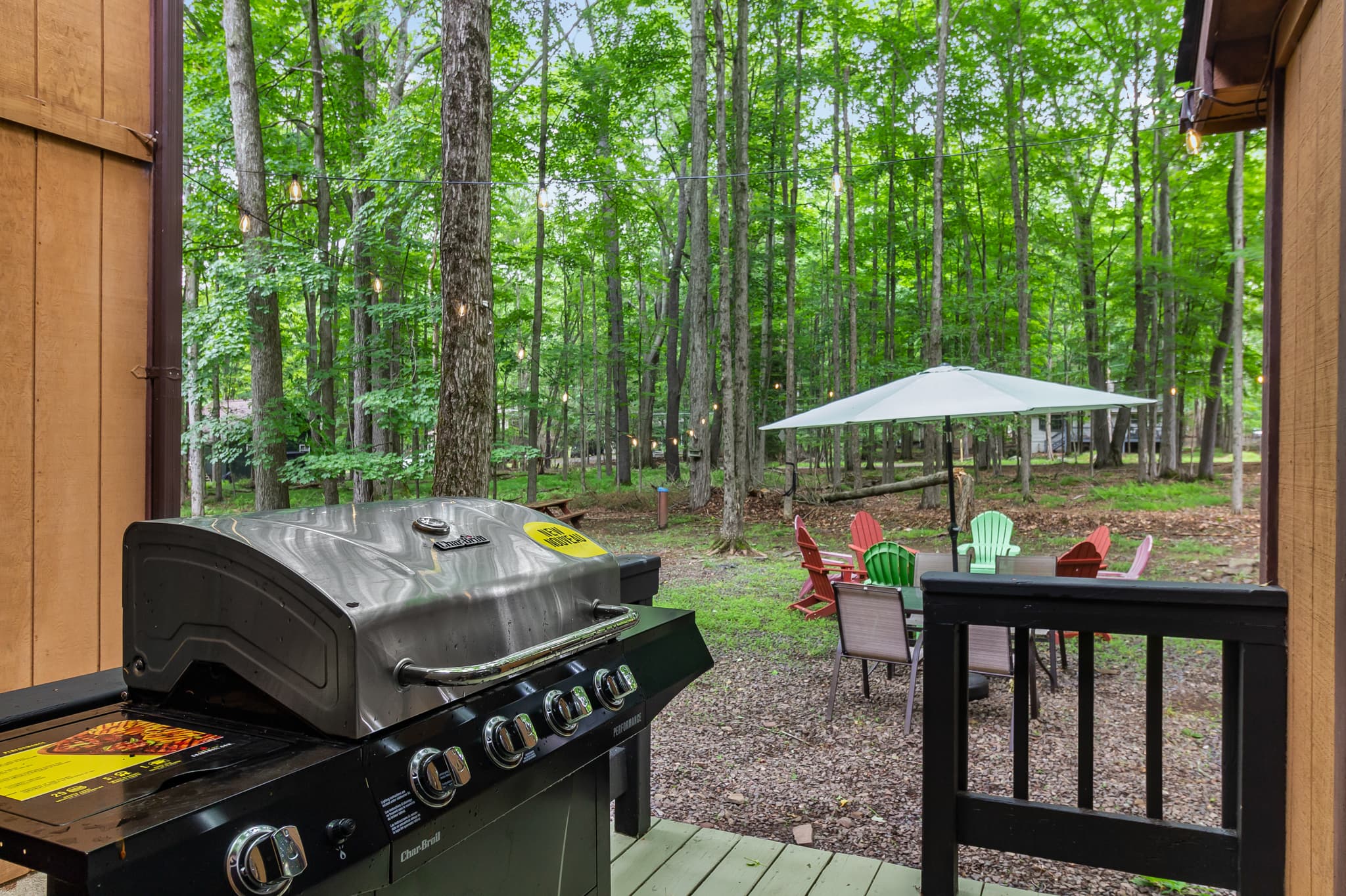 rear porch with BBQ grill. Backyard with firepit