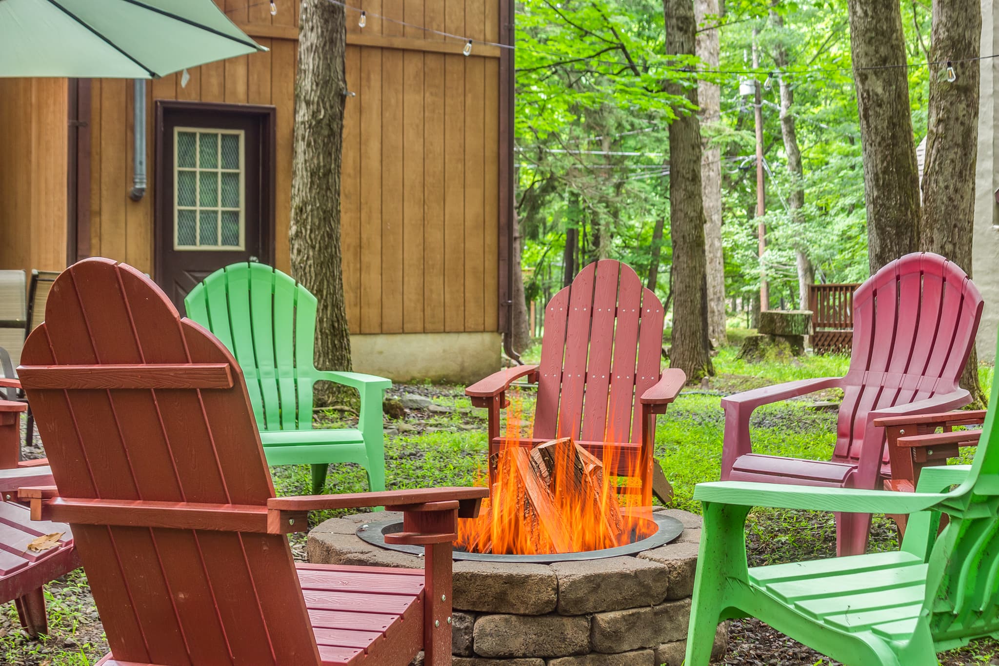 Backyard with firepit, table and seating