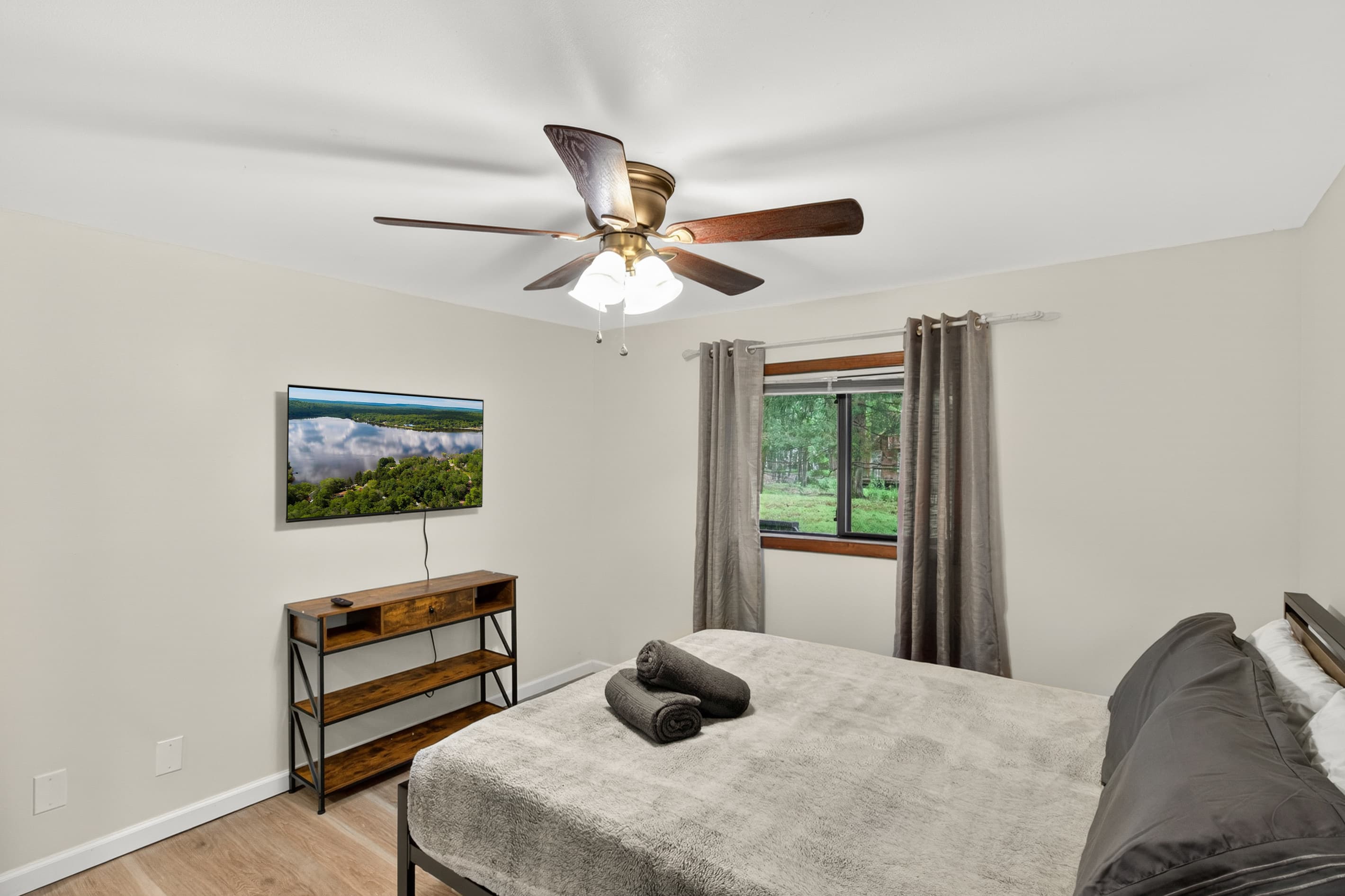 Bedroom 2 with queen bed and Roku TV, on first floor