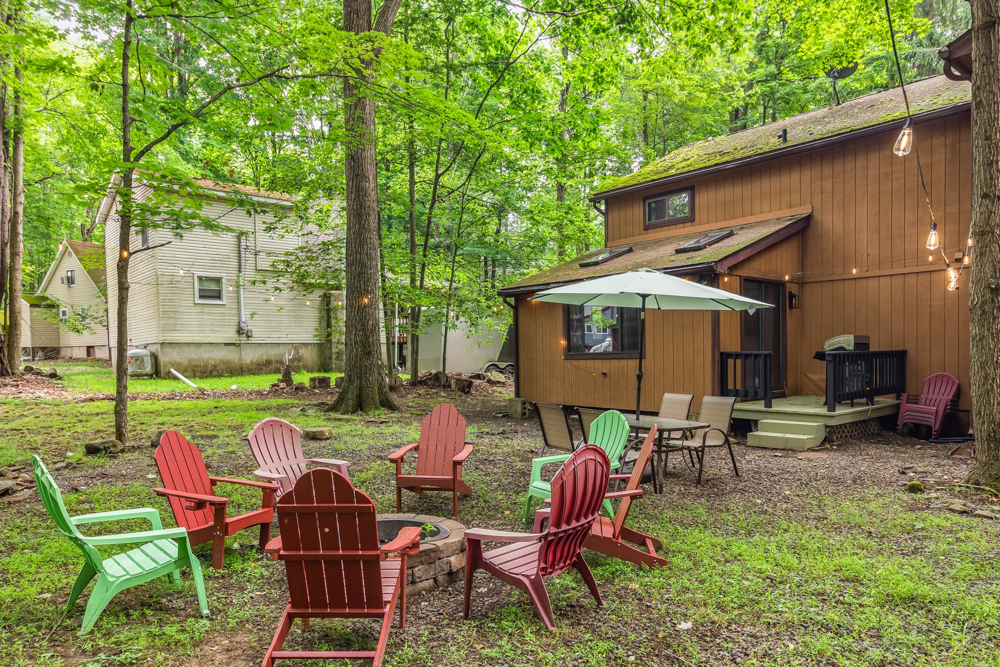 Backyard with firepit, table and seating