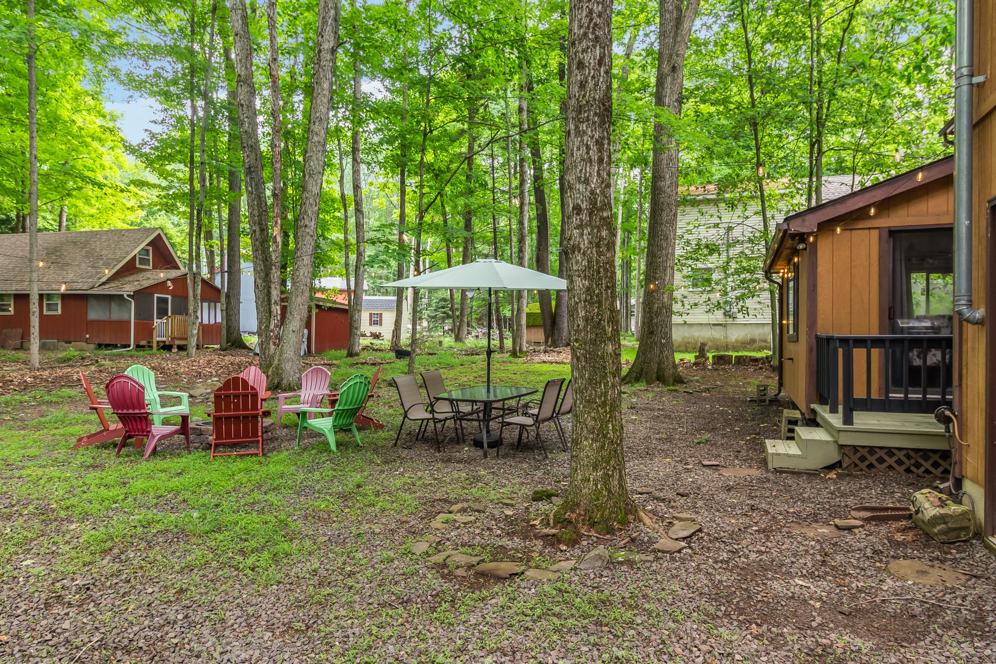 Backyard with firepit, table and seating