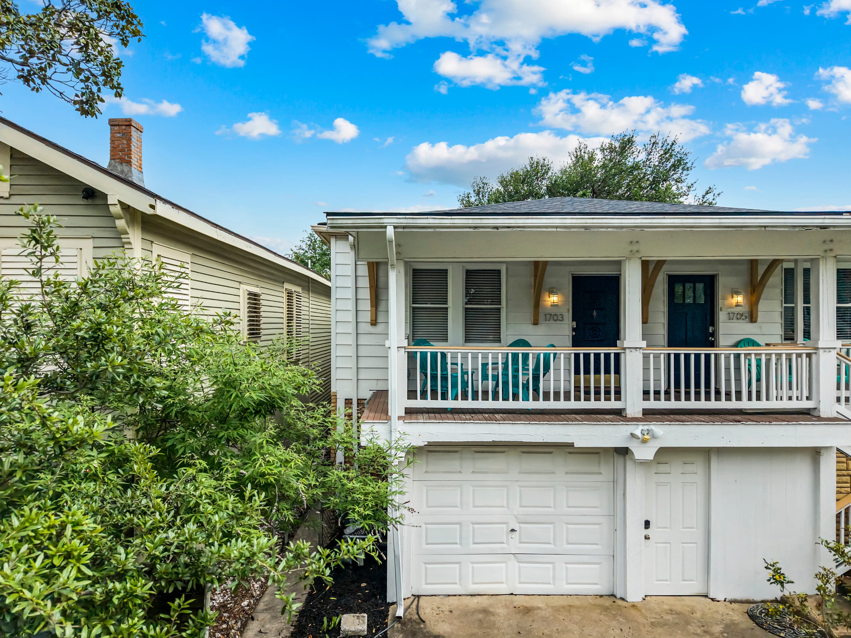 Port Side at M at 1703 Avenue M — the upper-left unit of a beautifully maintained historic triplex with classic Galveston curb appeal.