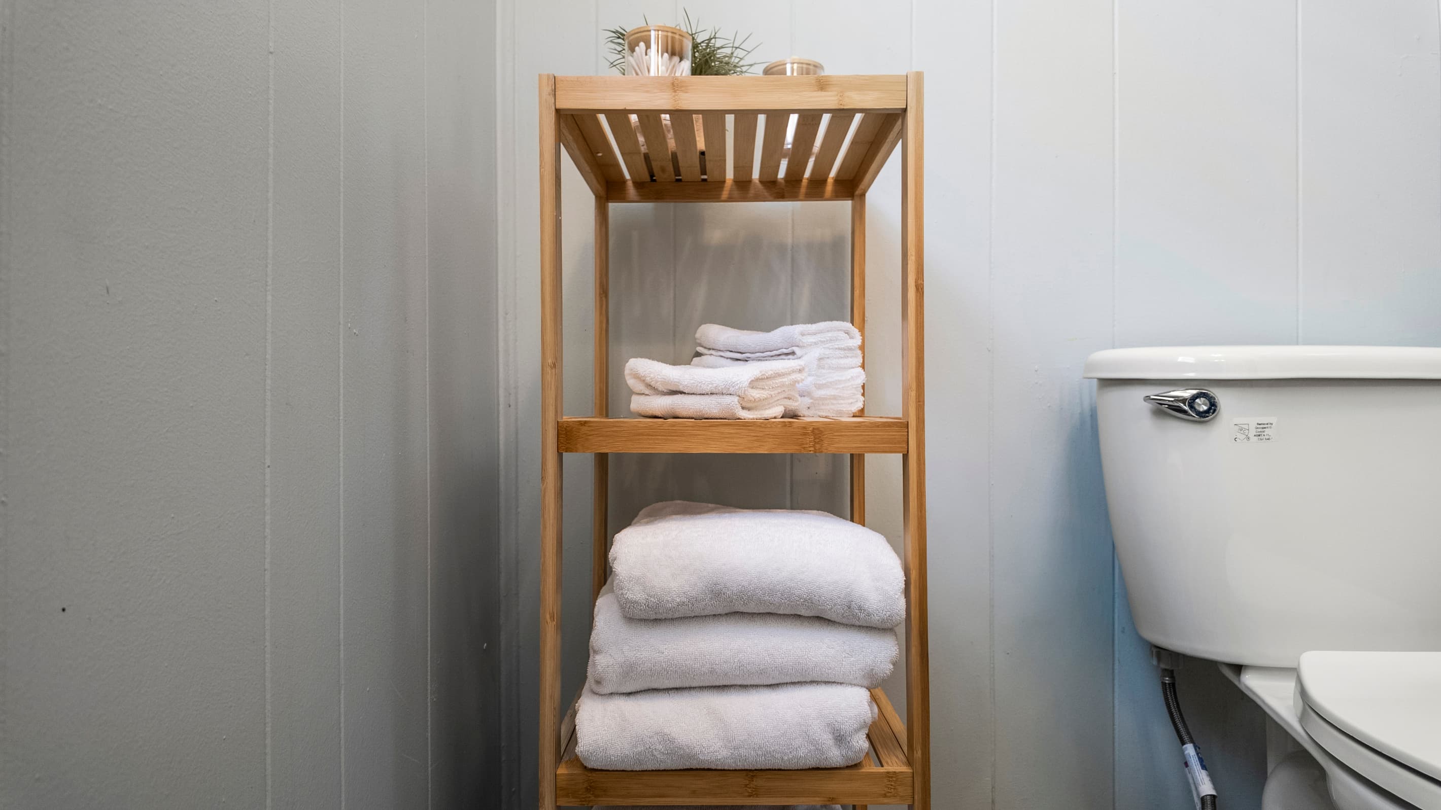 Fresh, fluffy towels are stacked and ready — no need to pack linens, everything is provided for your stay.