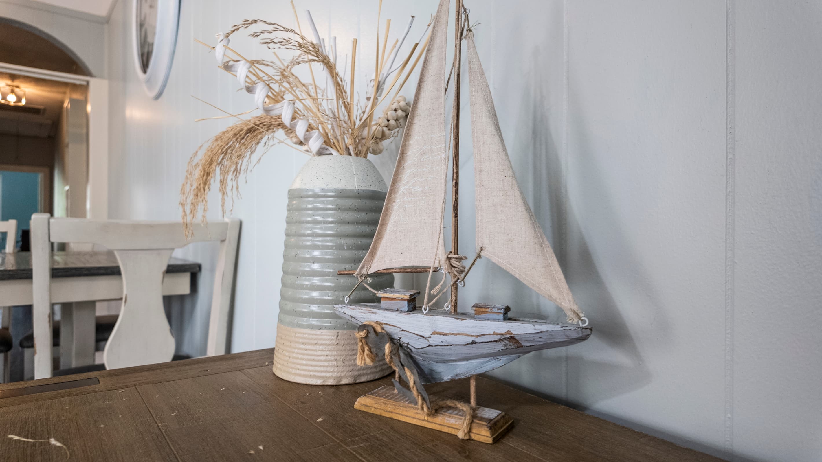 The covered porch is a peaceful retreat — kick back and enjoy the quiet pace of Galveston's historic Lost Bayou District.