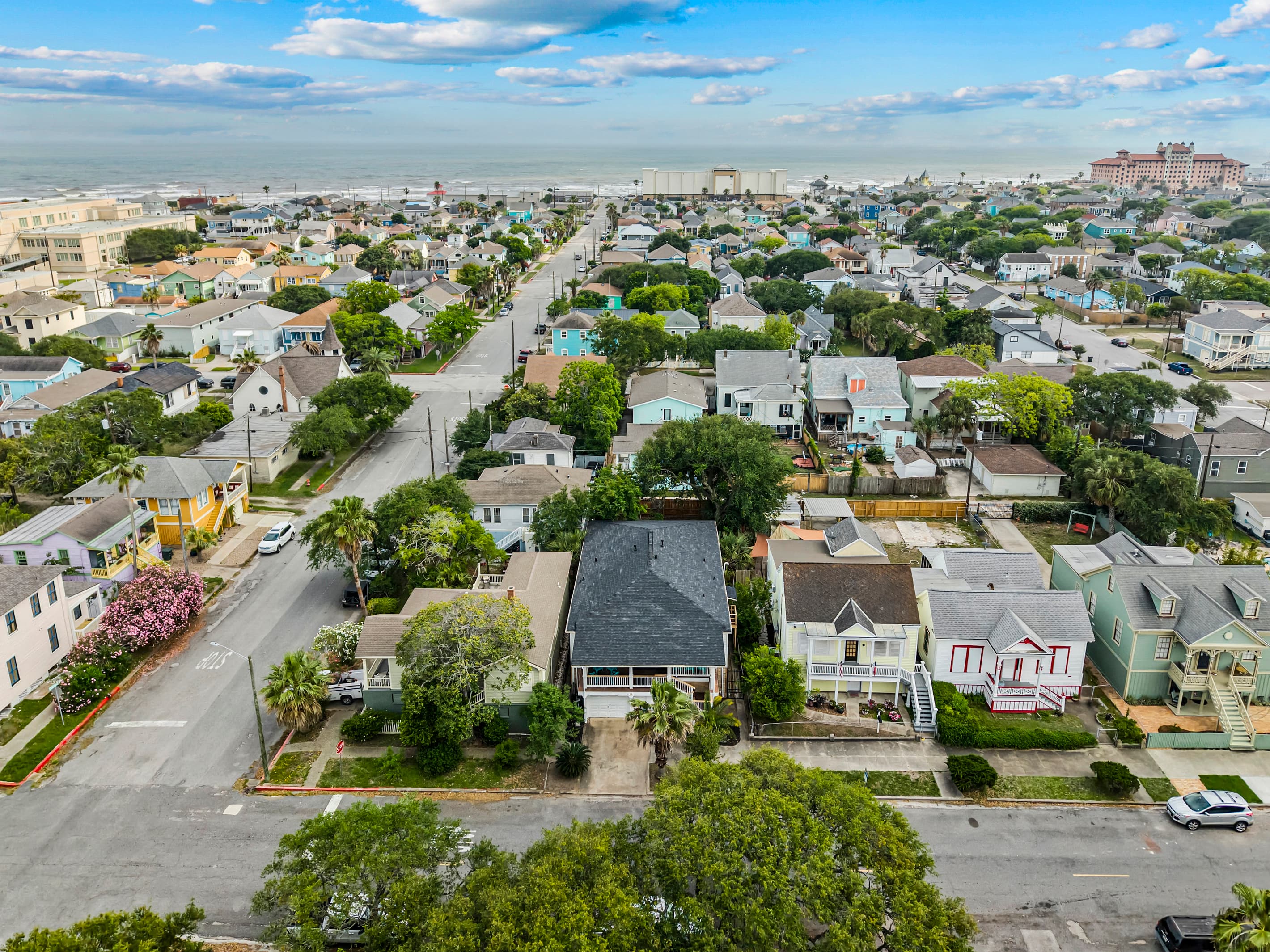 A bird's-eye view of the neighborhood around 1703 Avenue M — classic Galveston streetscapes with the beach close by.