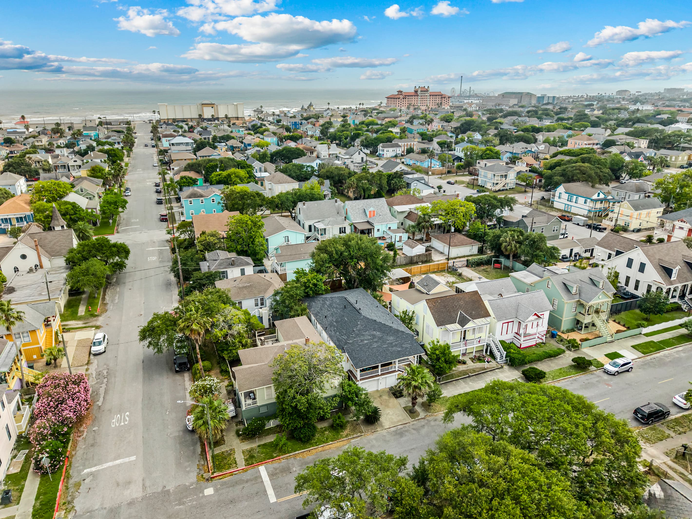From above, you can see how walkable Port Side at M is — the beach, seawall, and island attractions are all close.