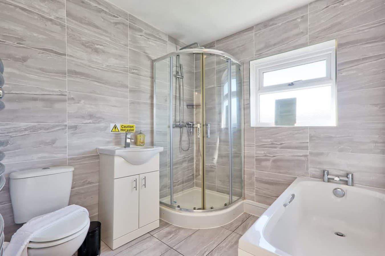 Bathroom with bath and shower