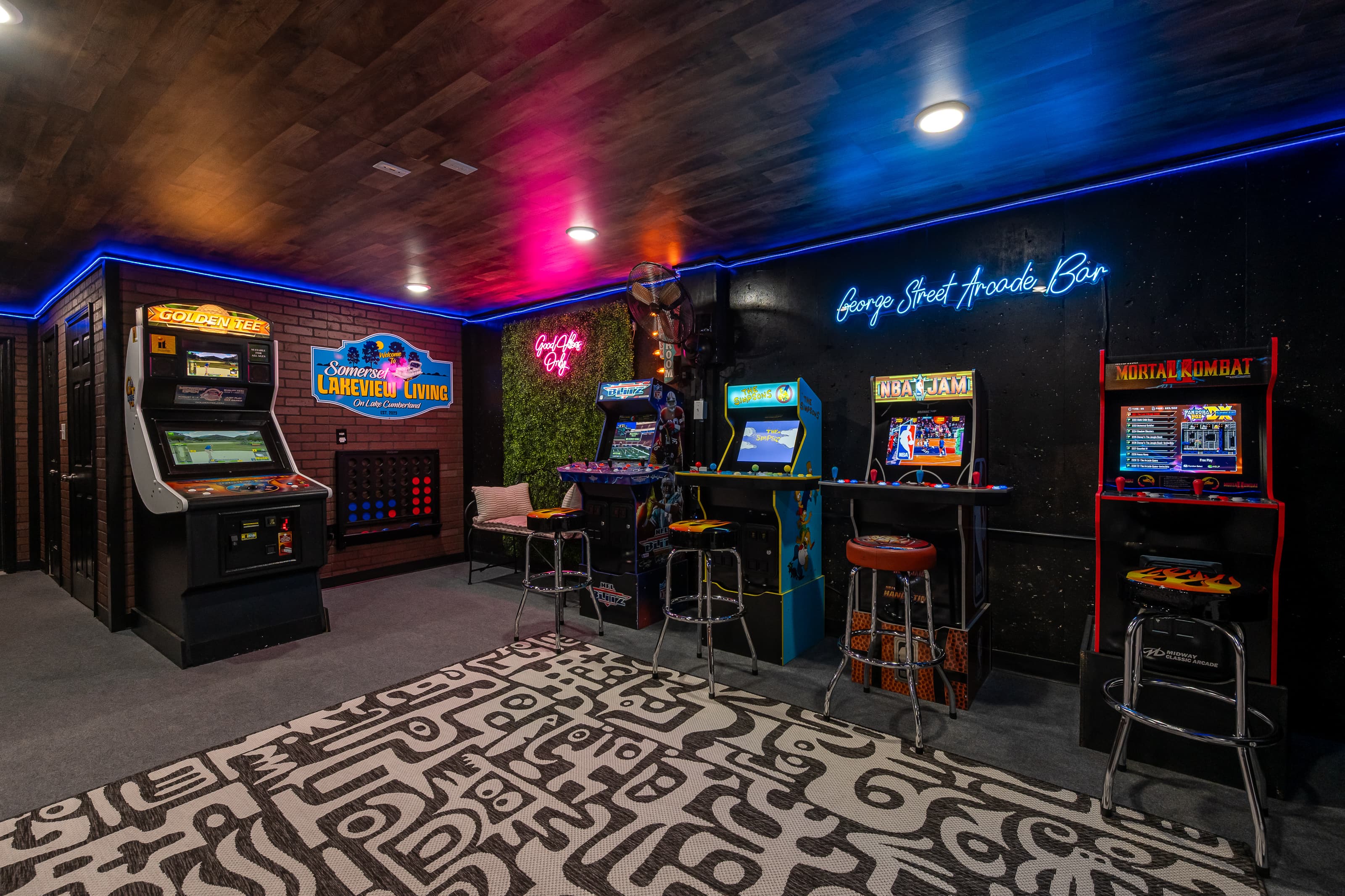 Epic arcade game room featuring retro classics and 5000+ games on Mortal Kombat. GoldenTee 2026!