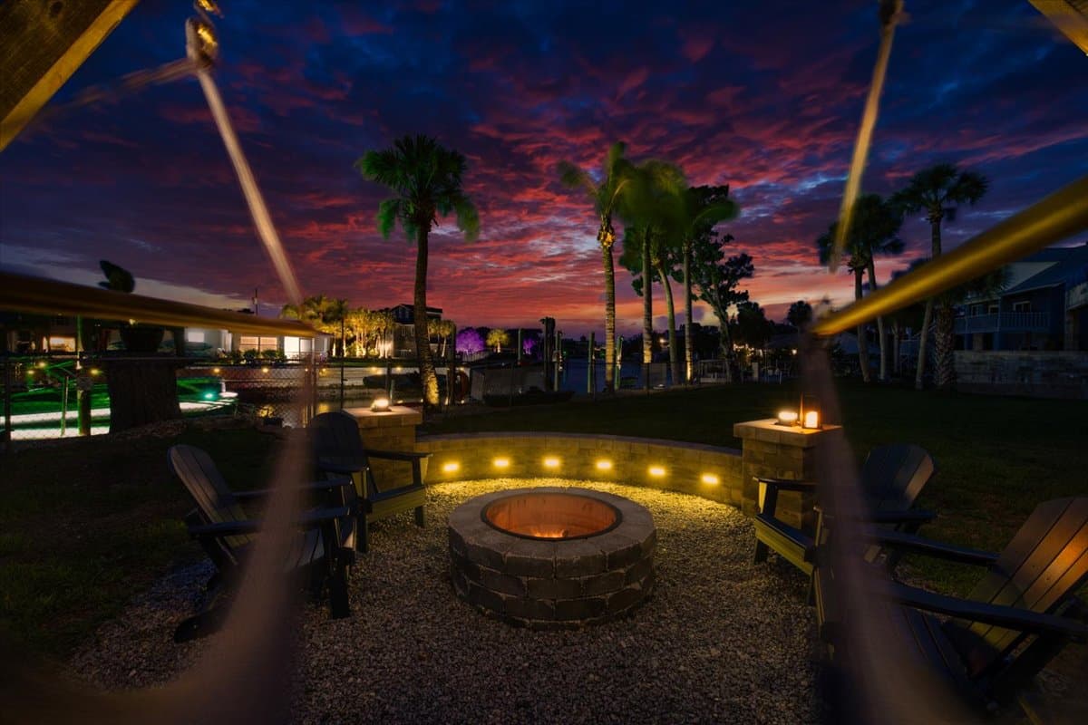 Gather around the waterfront fire pit as the sky lights up at sunset.beneath the palms, relax in the hanging chairs, and enjoy unforgettable Florida sunsets over the canal.