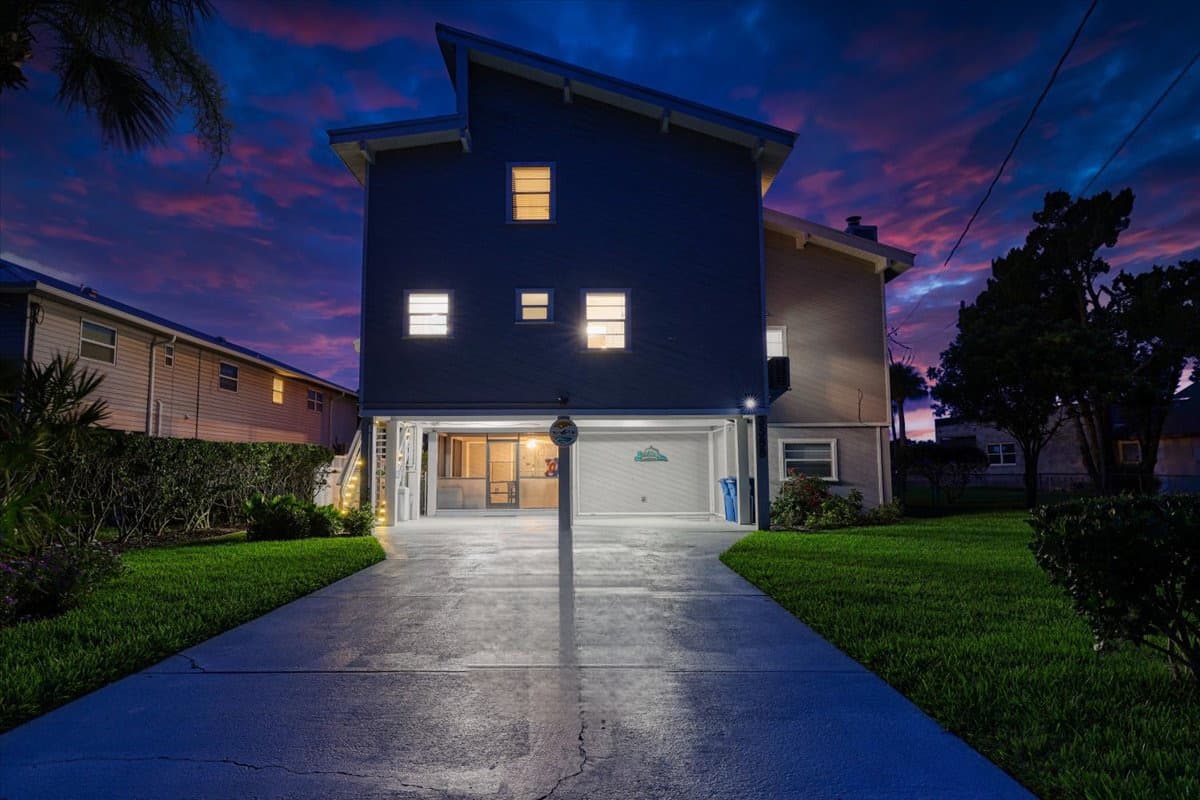 Spacious driveway with parking for multiple vehicles and boat trailers.