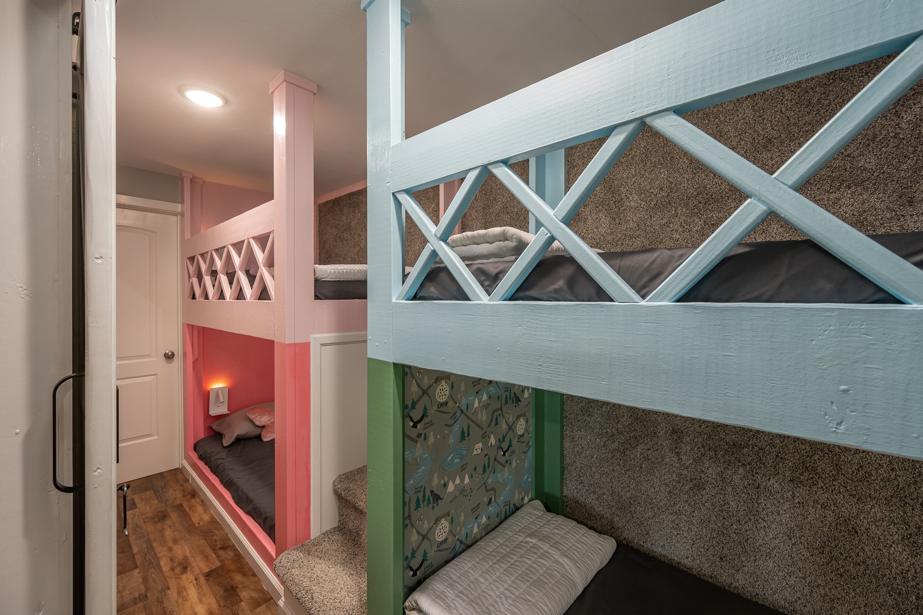 "The bunk area," with two sets of bunk beds, is a playful space for kids, adults will fit also.