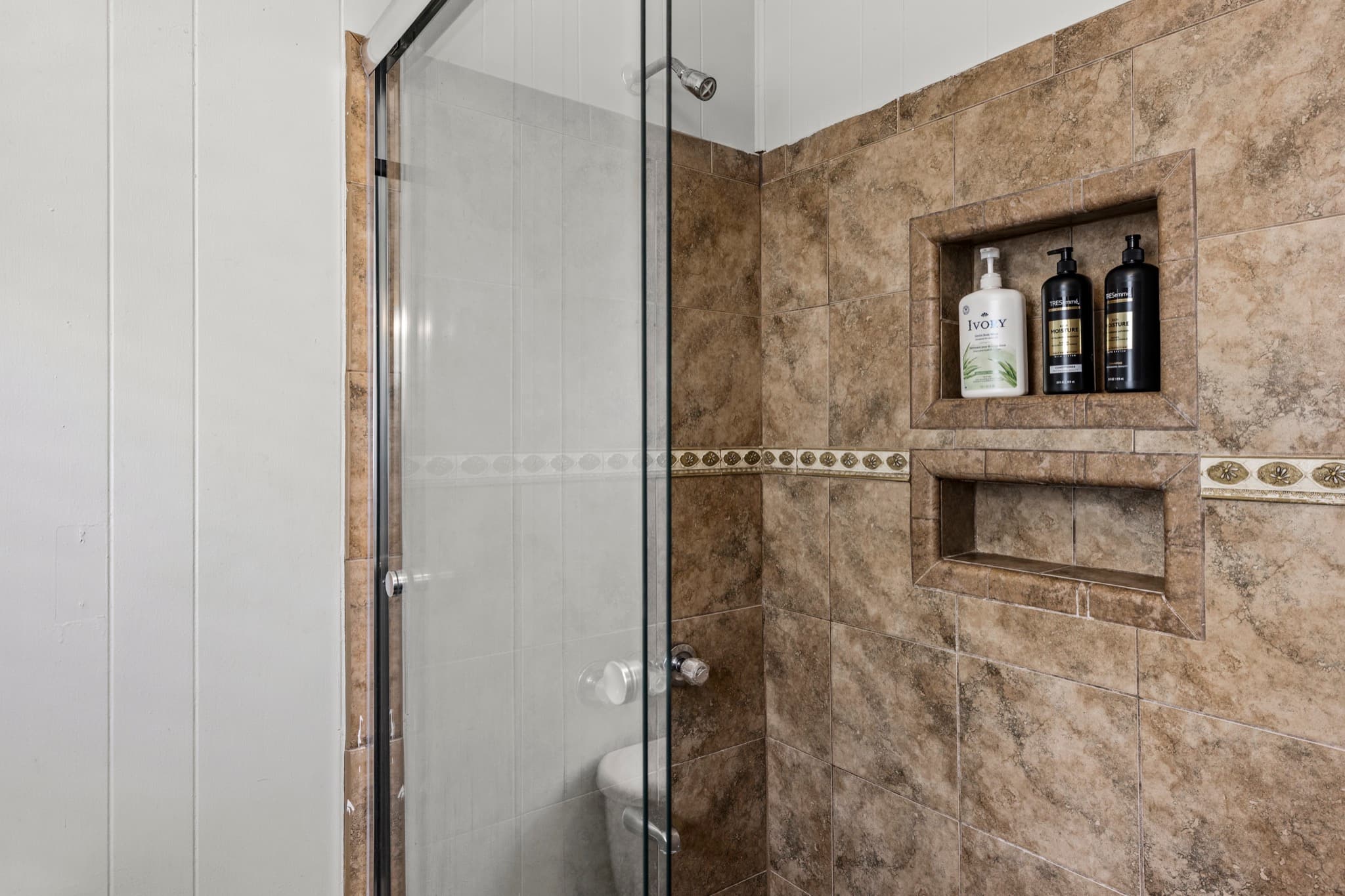 Port Side at M (Upper Left) — the full bathroom with a renovated stand-up shower (plus a half bath).