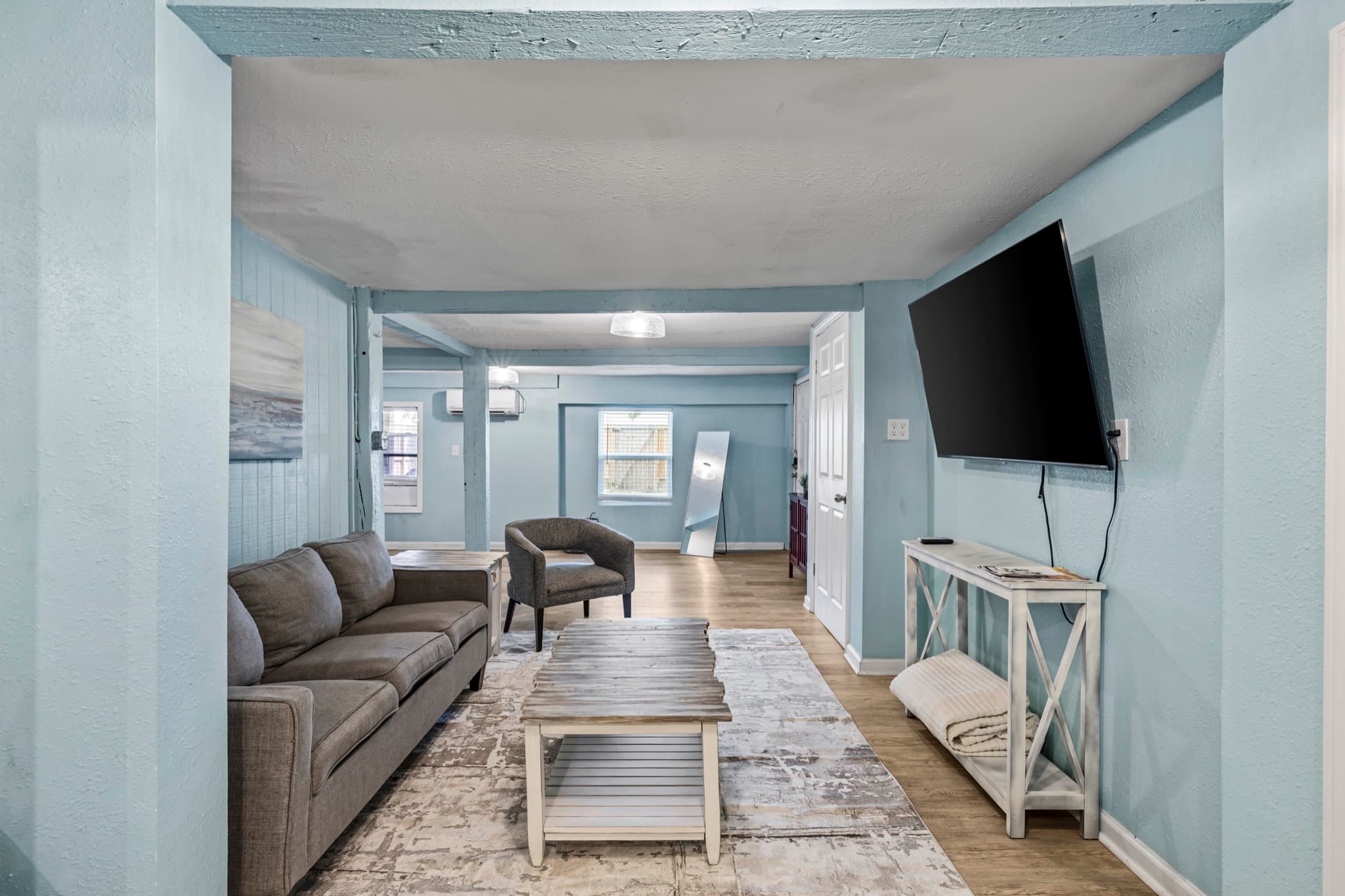 Historic Anchor at M (Studio) — a comfortable open-plan living area with a smart TV; the studio sleeps 7 and rounds out the Trio.