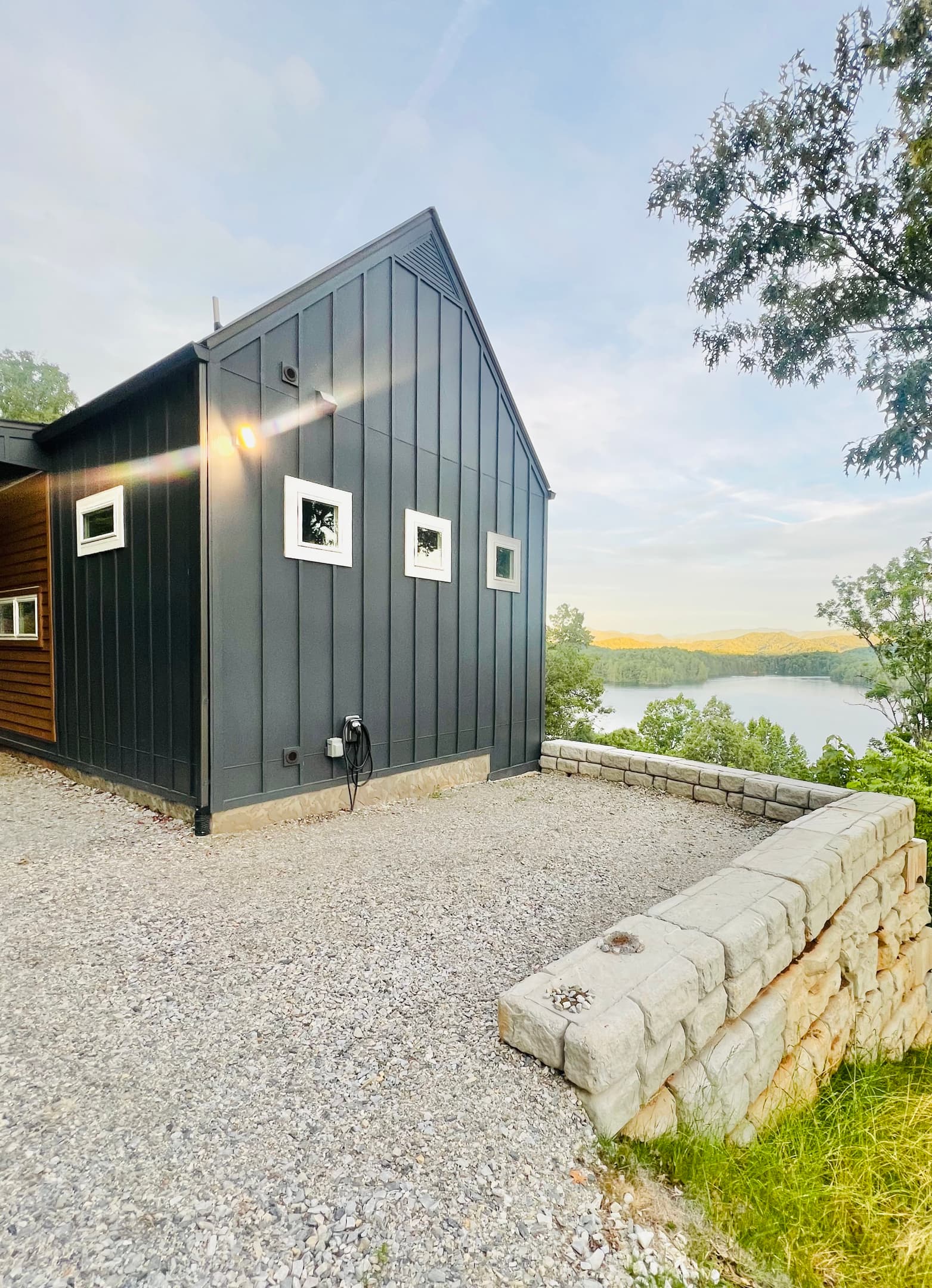 Modern mountain design meets lake living.
Hidden Point House welcomes you with contemporary architecture, convenient parking, and glimpses of Lake Santeetlah before you even step inside.