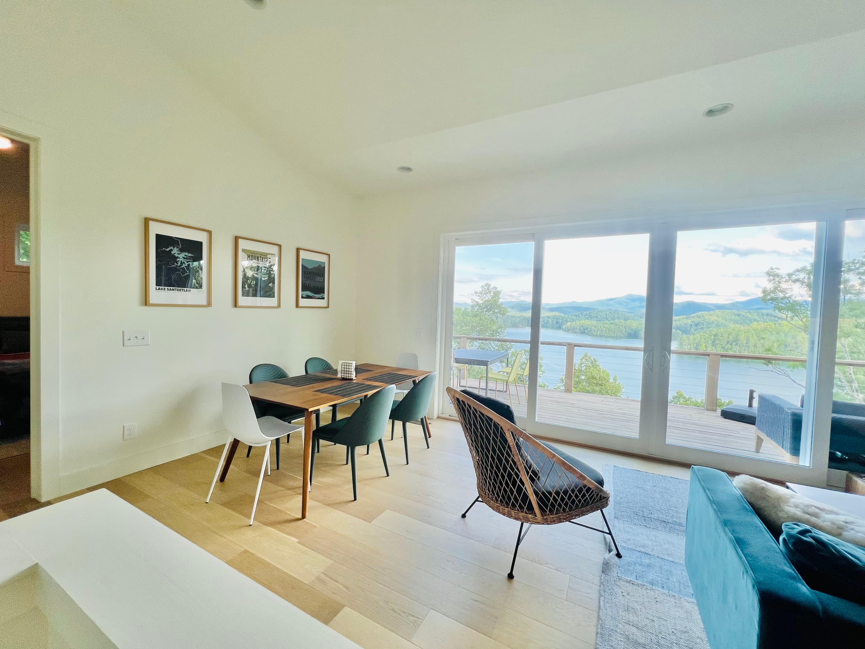 The heart of the home.
The open-concept living and dining area is filled with natural light and framed by stunning lake and mountain views. Gather for meals, relax with loved ones, or simply enjoy the scenery from the comfort of indoors.