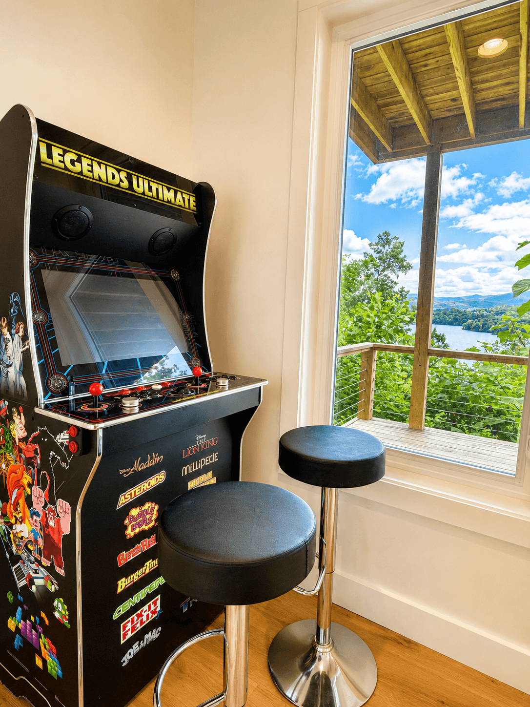 A little friendly competition with a view.
The lower-level rec room features a multicade arcade packed with classic games, plus a window overlooking the beauty of Lake Santeetlah.