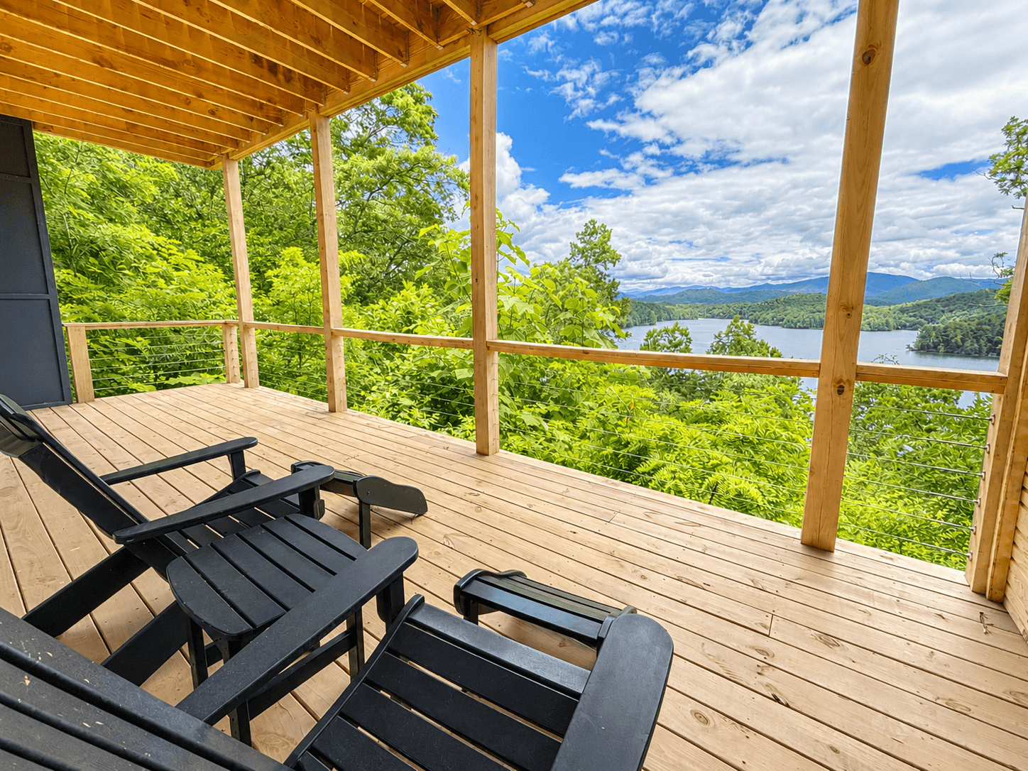 Your favorite seat in the house might be outside.
Relax in an Adirondack chair, enjoy the shade provided by the upper deck, and watch the scenery change throughout the day.