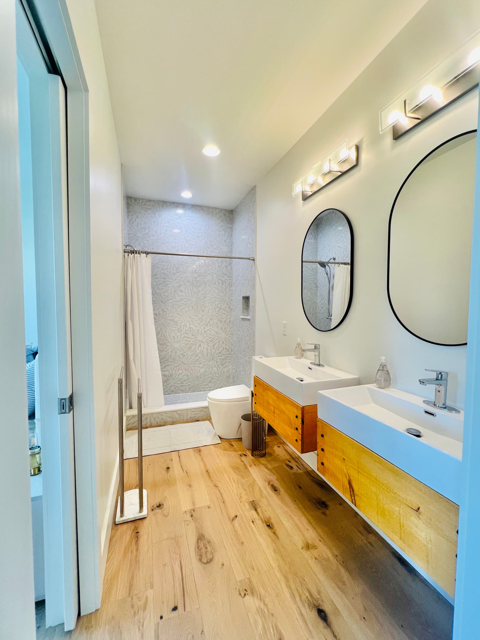 Thoughtfully designed for sharing.
This lower-level bathroom features double vanities and a spacious shower, with convenient access from both the rec room and the queen bedroom—making it easy for families and groups to spread out and relax at Hidden Point 