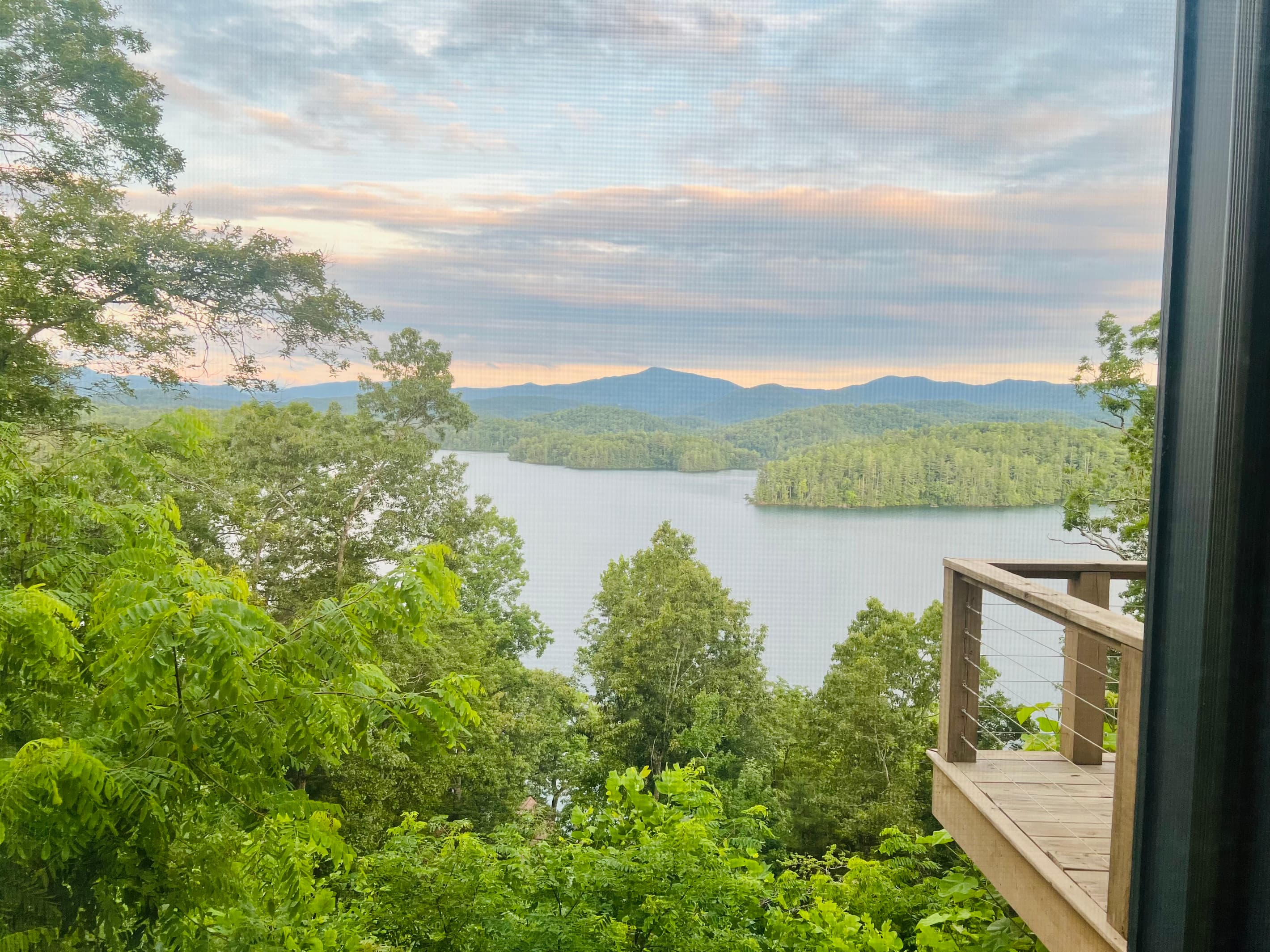 Every window frames a masterpiece. 🏞️ Hidden Point House overlooks one of North Carolina's most beautiful mountain lakes.