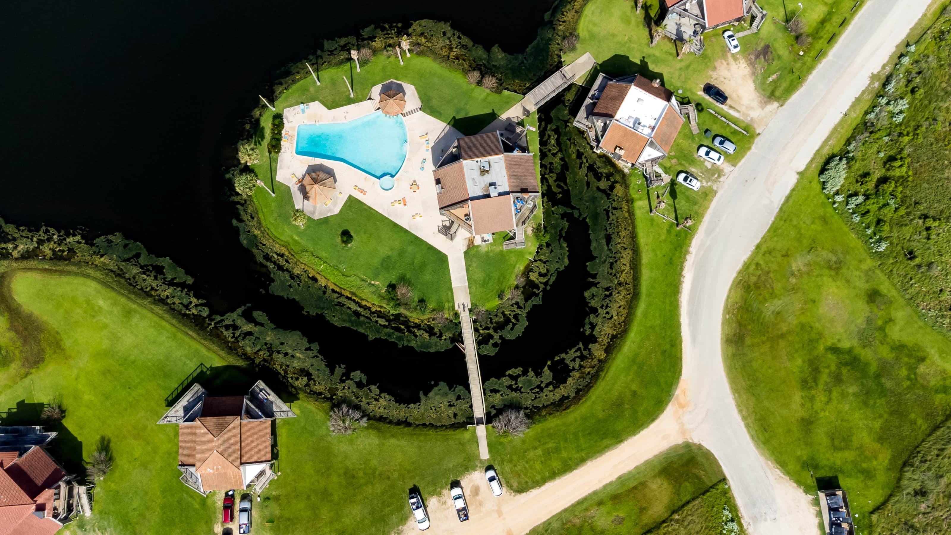 Lagoon enclosed pool with bridge