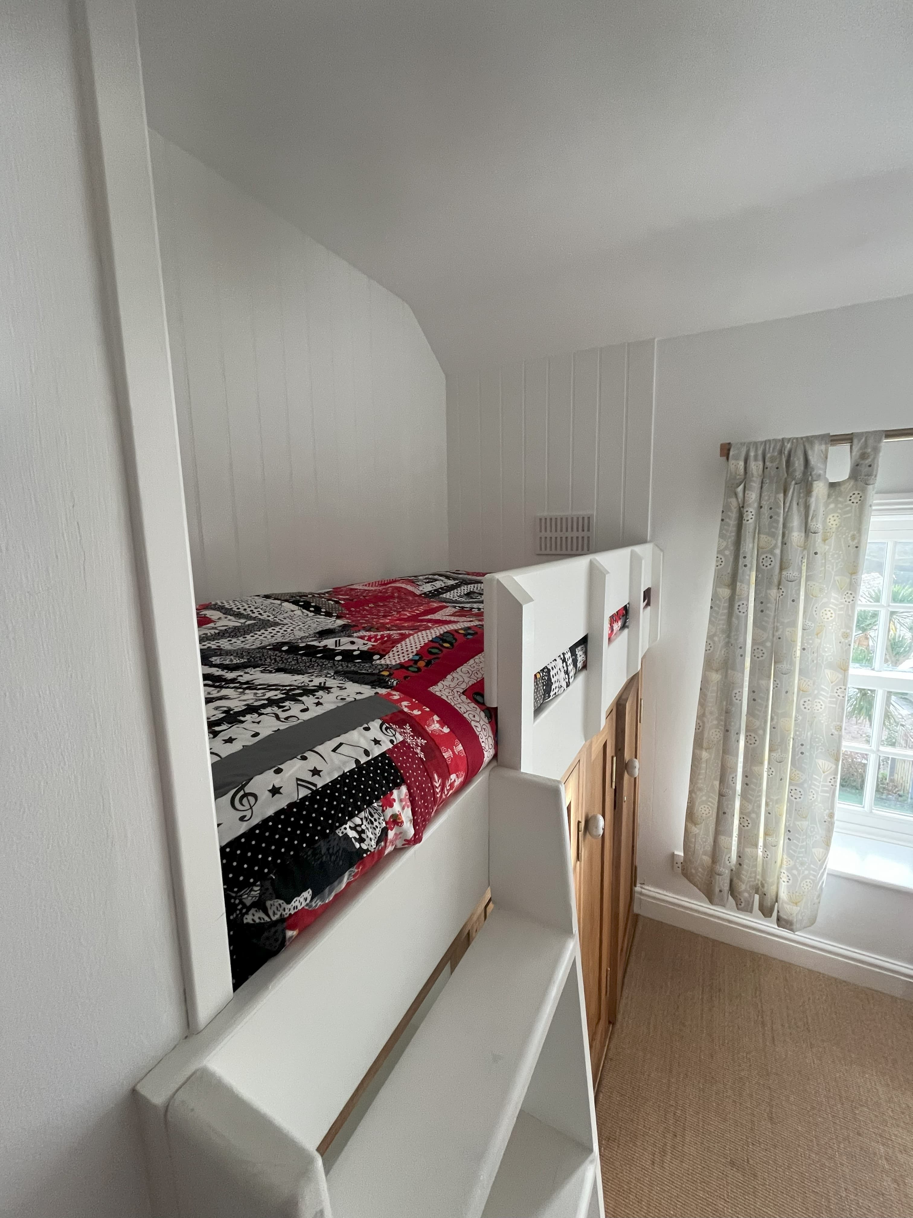 Walk through room with cabin bed and work space 