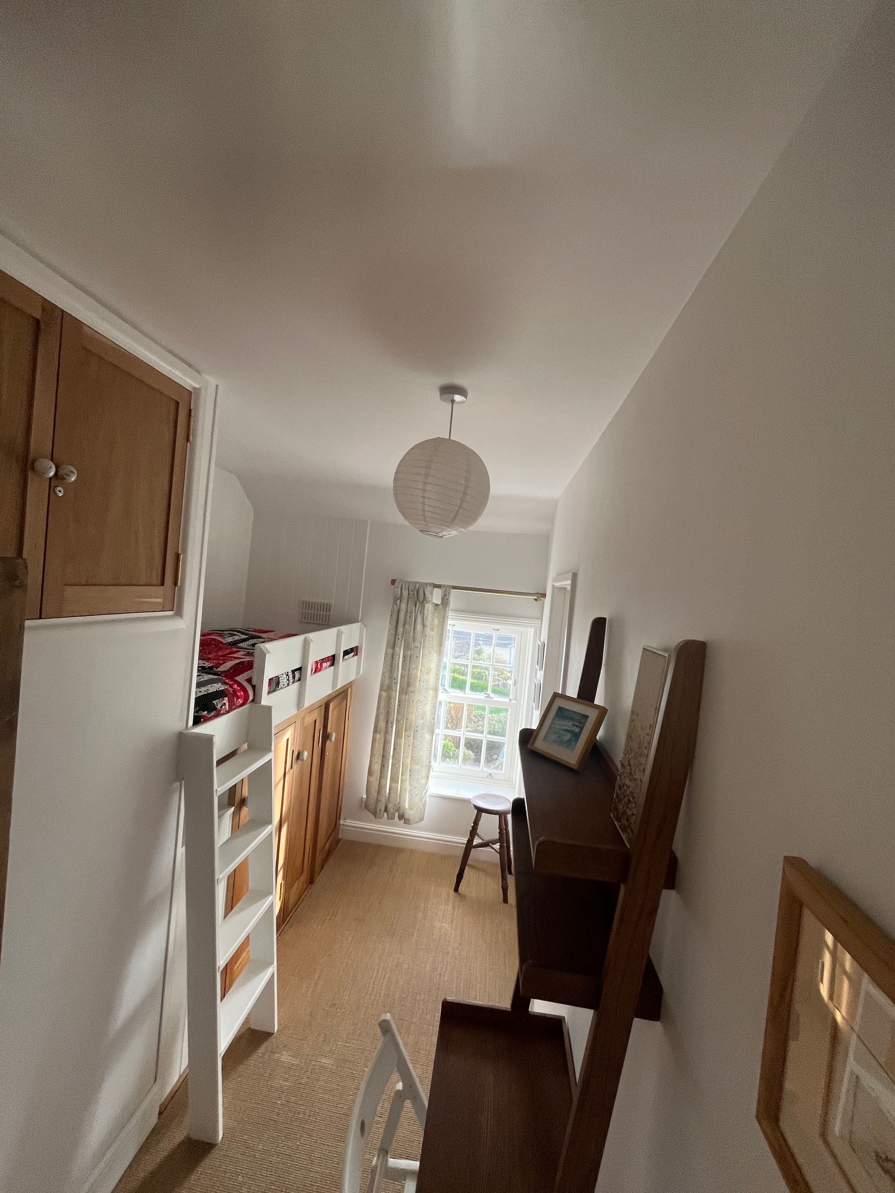 Walk through room with cabin bed and work space 