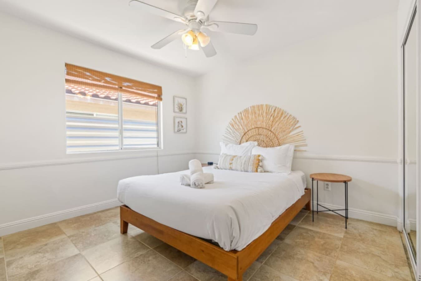 Calm bedroom retreat w/ soft tones, textured accents & natural light for easy rest after long days.