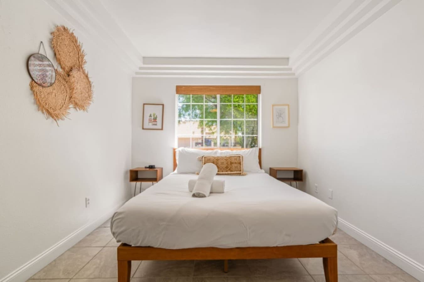 Serene bedroom w/ matching decor, cozy linens & simple styling for restful nights.